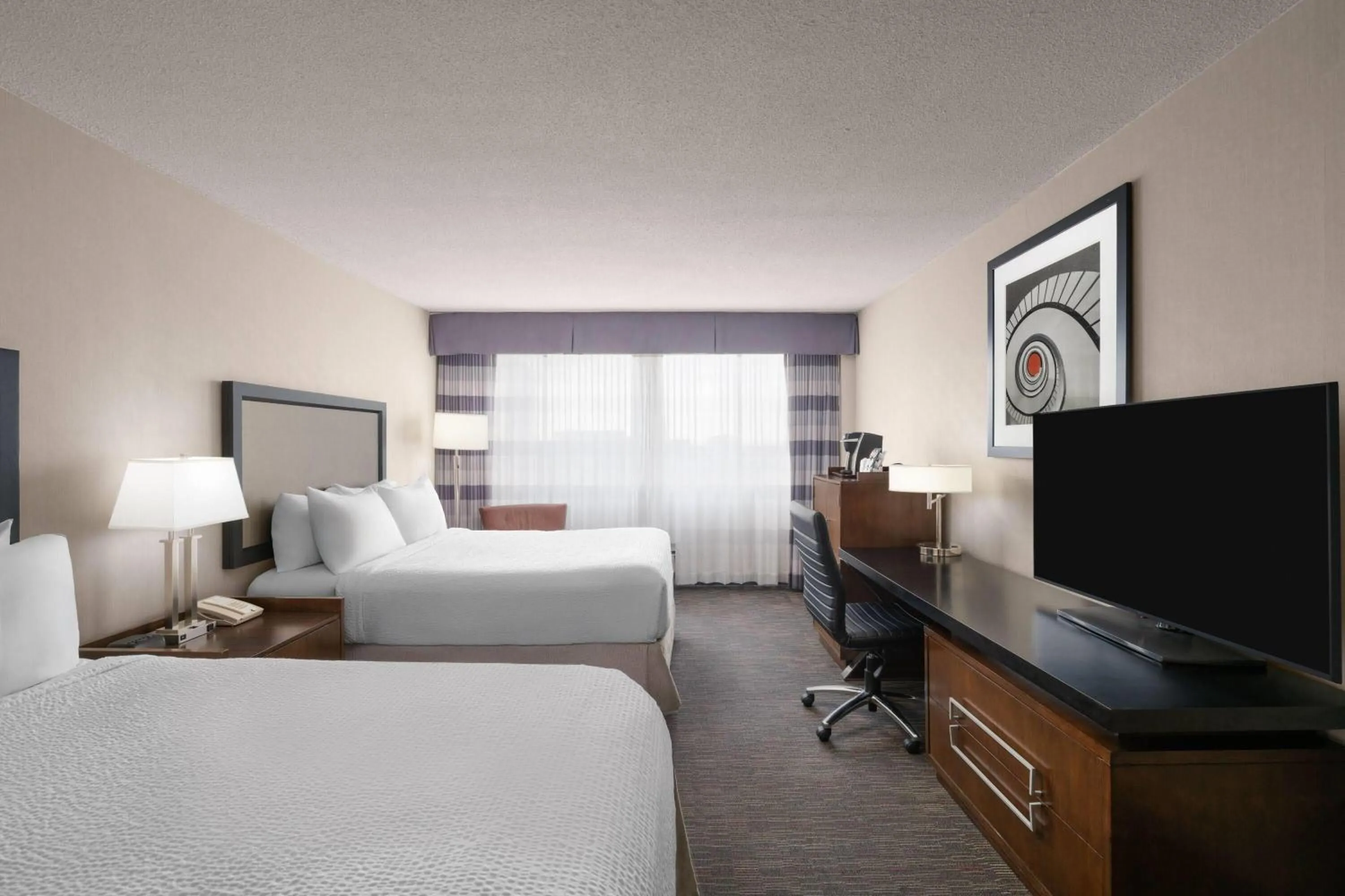 Photo of the whole room, Bed in Ramada Plaza by Wyndham Regina Downtown