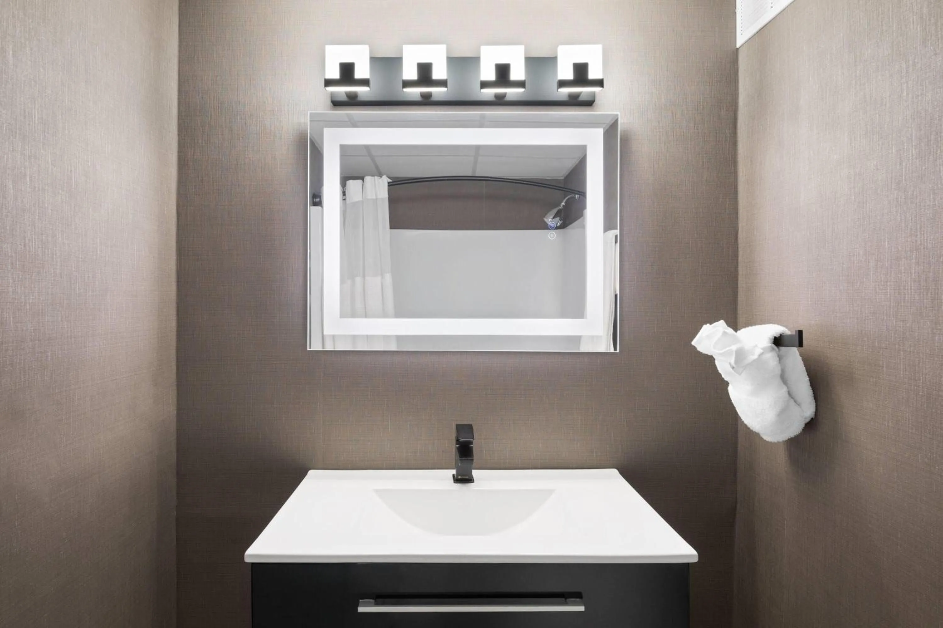 Bathroom in Ramada Plaza by Wyndham Regina Downtown