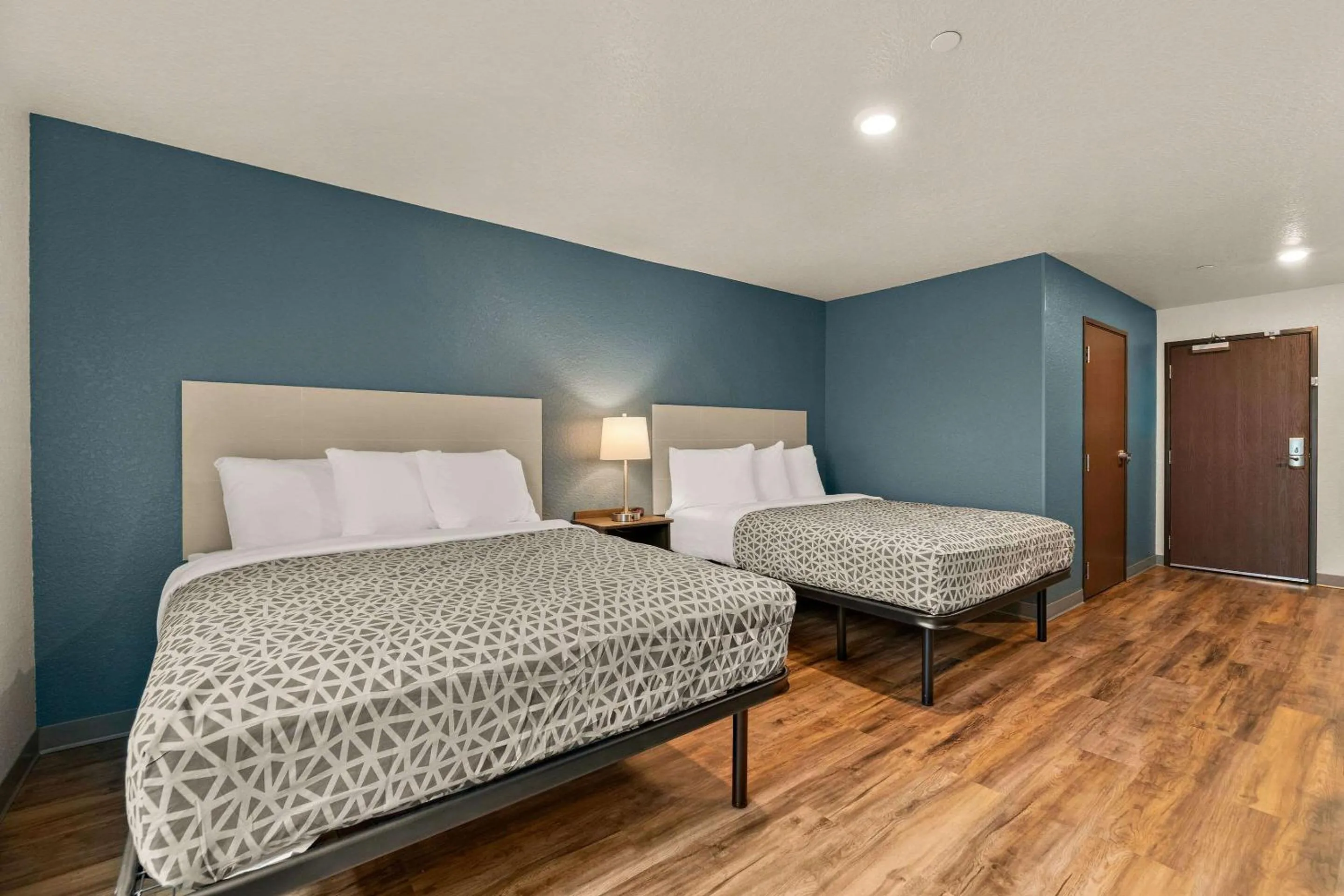 Bedroom, Bed in WoodSpring Suites Port Orange - Daytona Beach