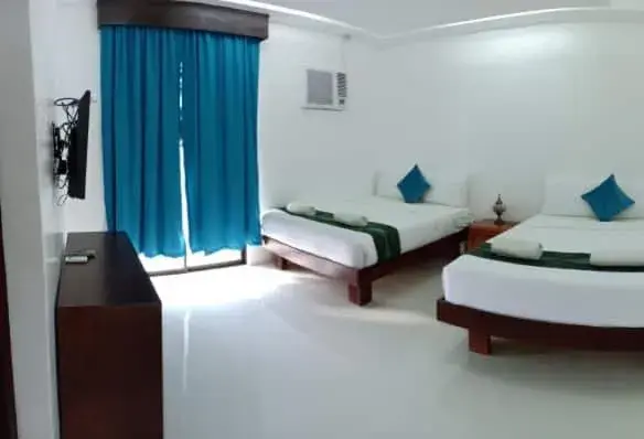 Bed in Discover Boracay Hotel