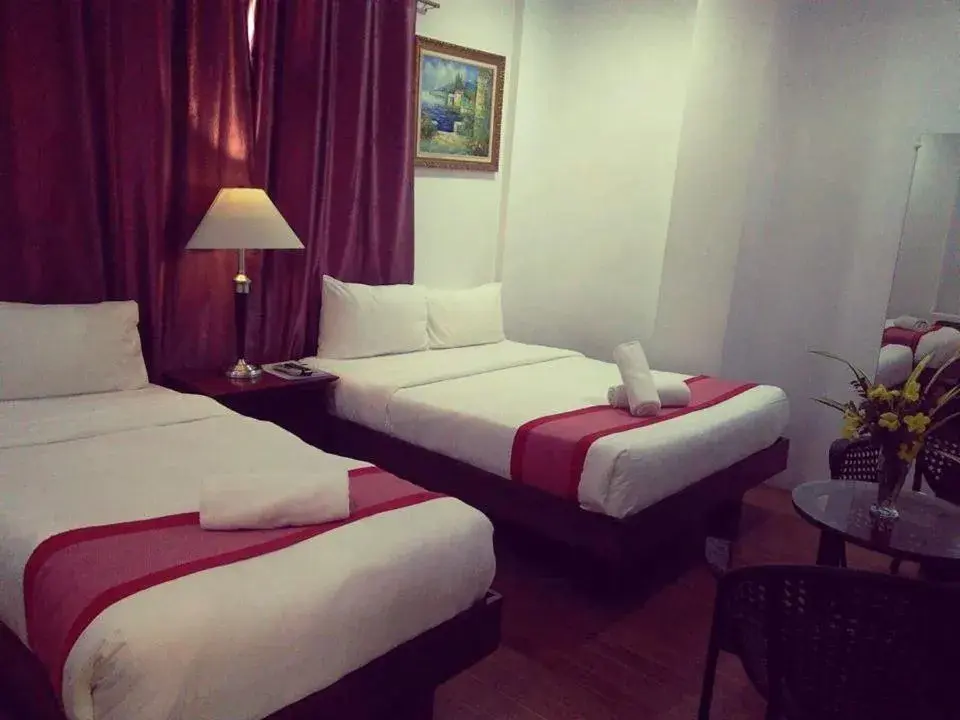 Bed in Discover Boracay Hotel