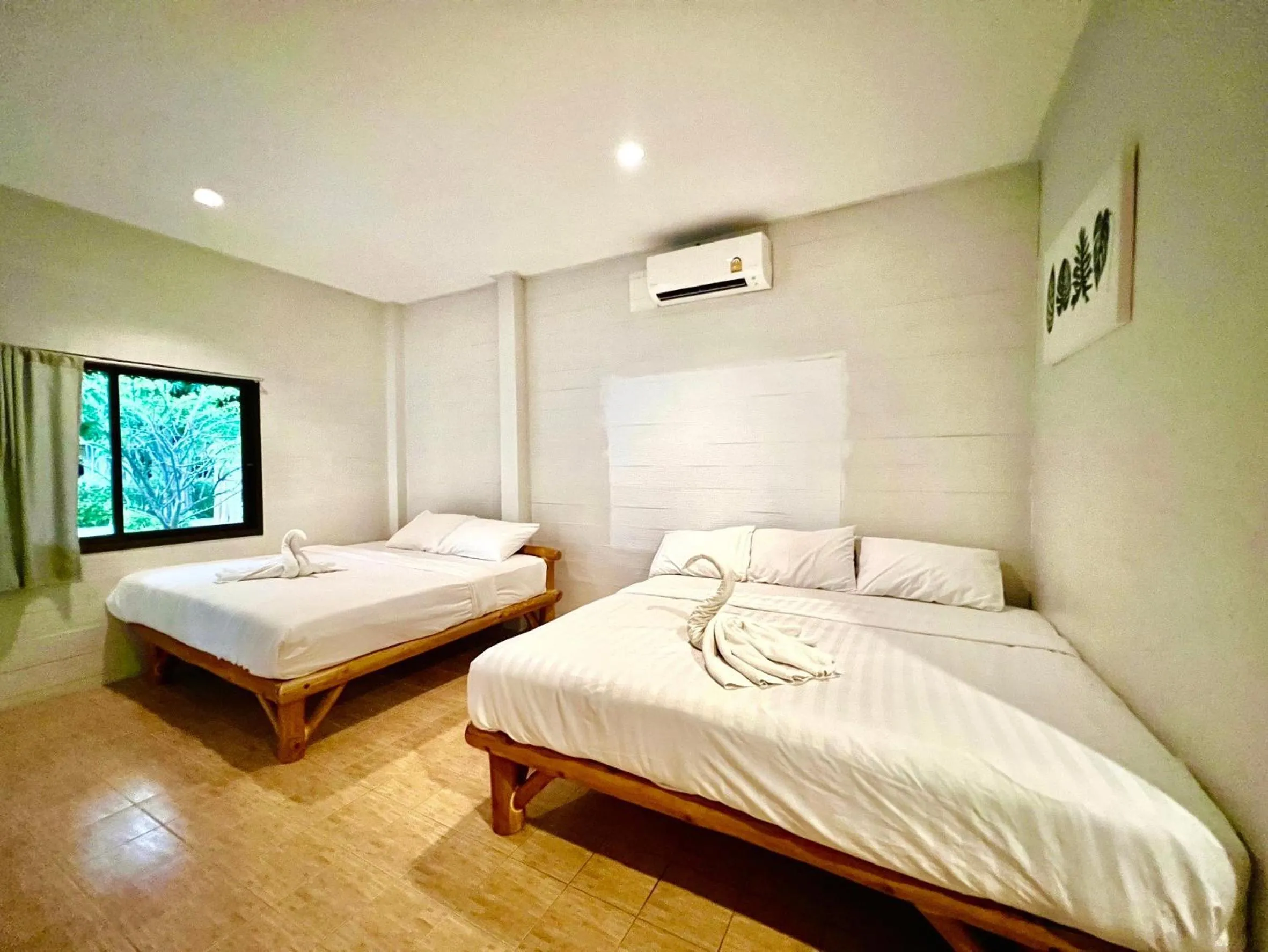 Bed in PHUPA BEACH Resort
