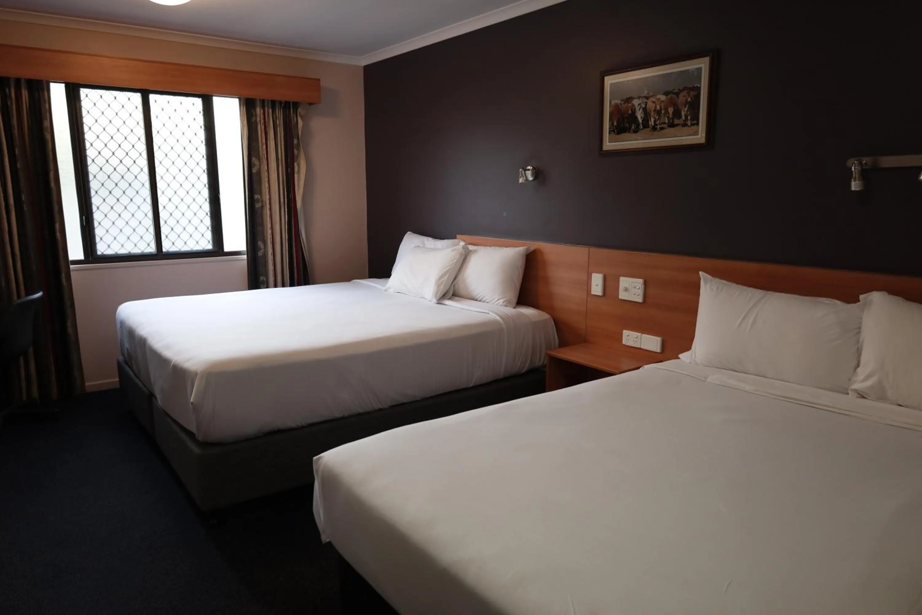 Bed in SunPalms Motel