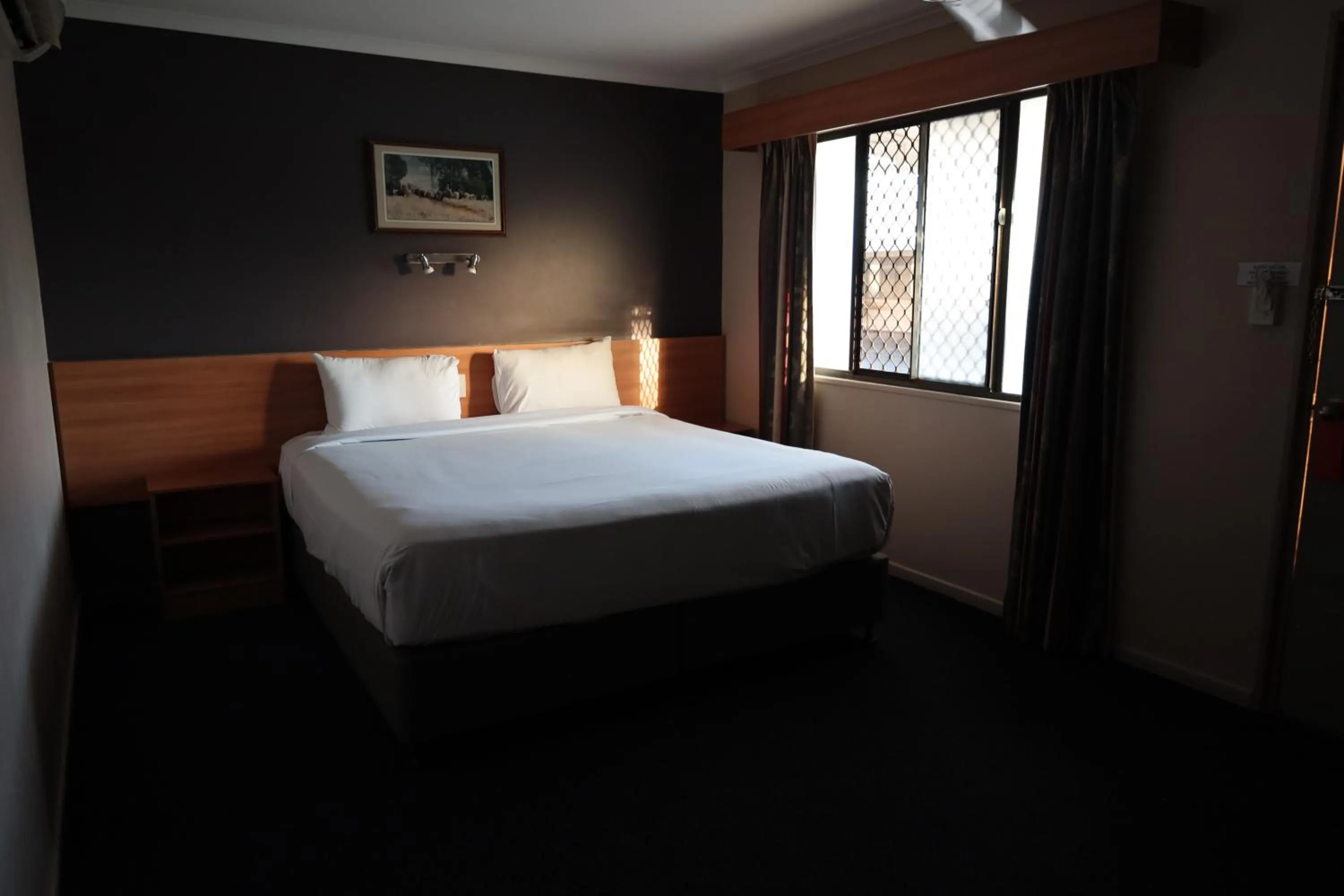 Bed in SunPalms Motel