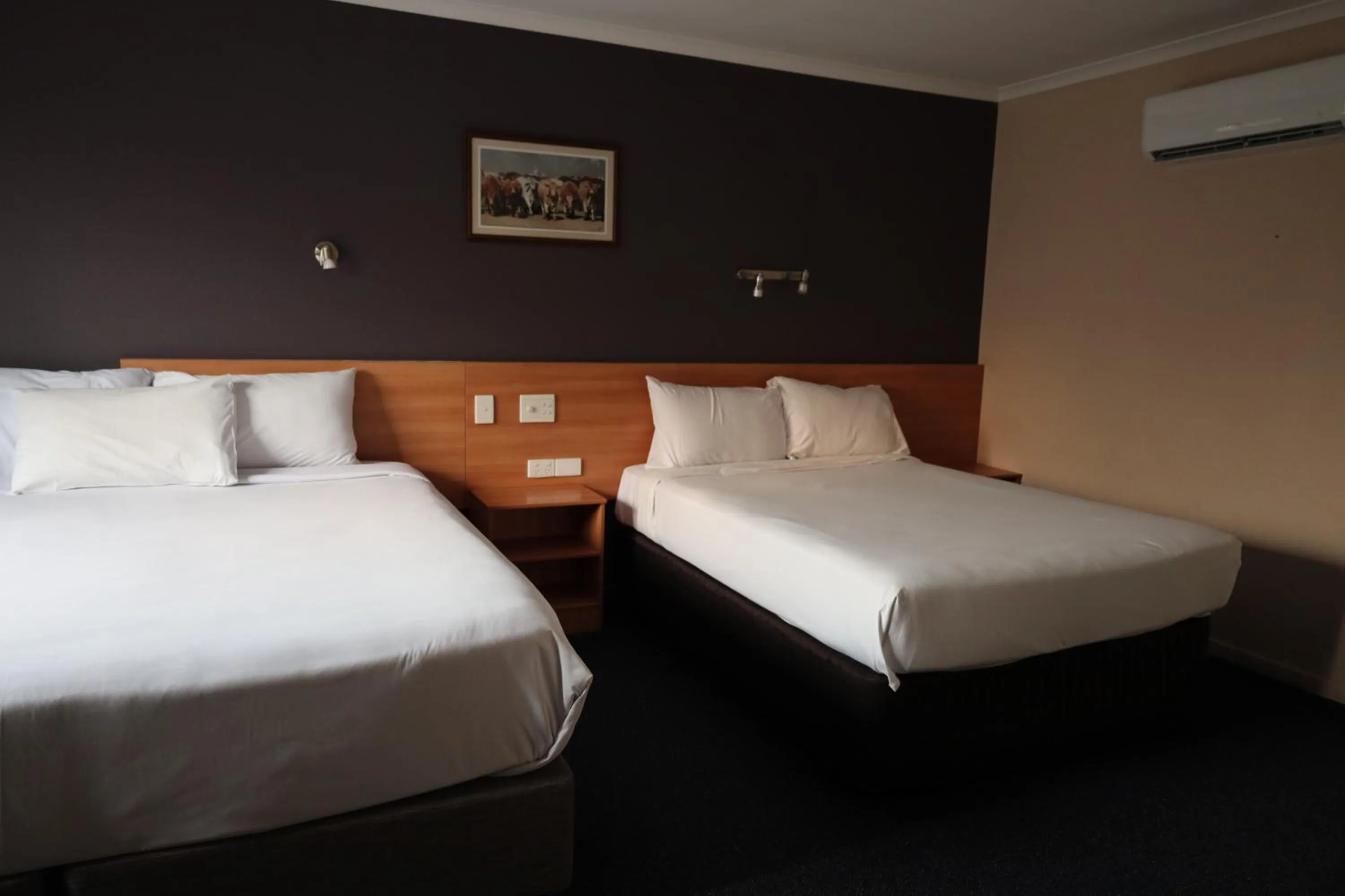 Bed in SunPalms Motel