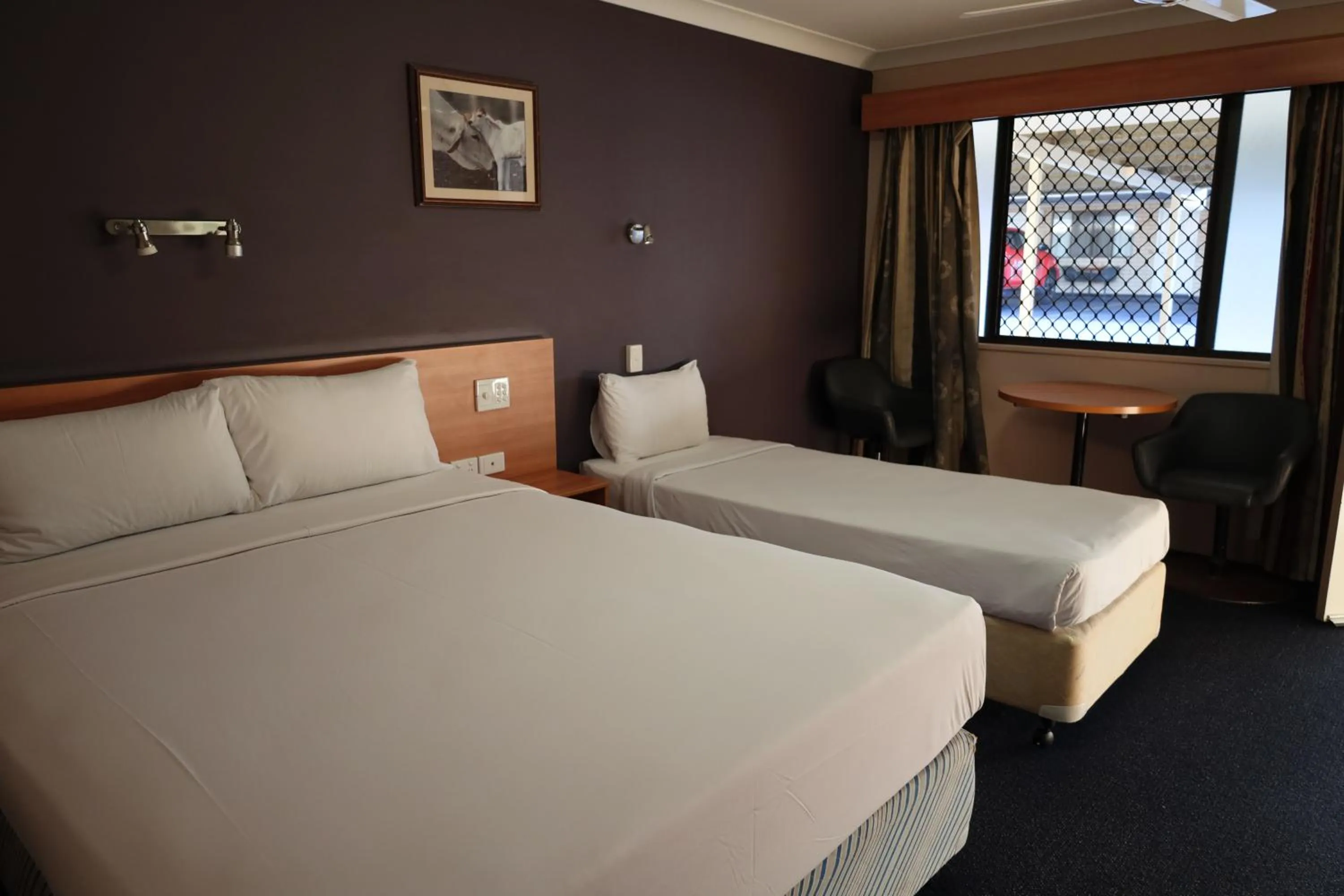 Bed in SunPalms Motel