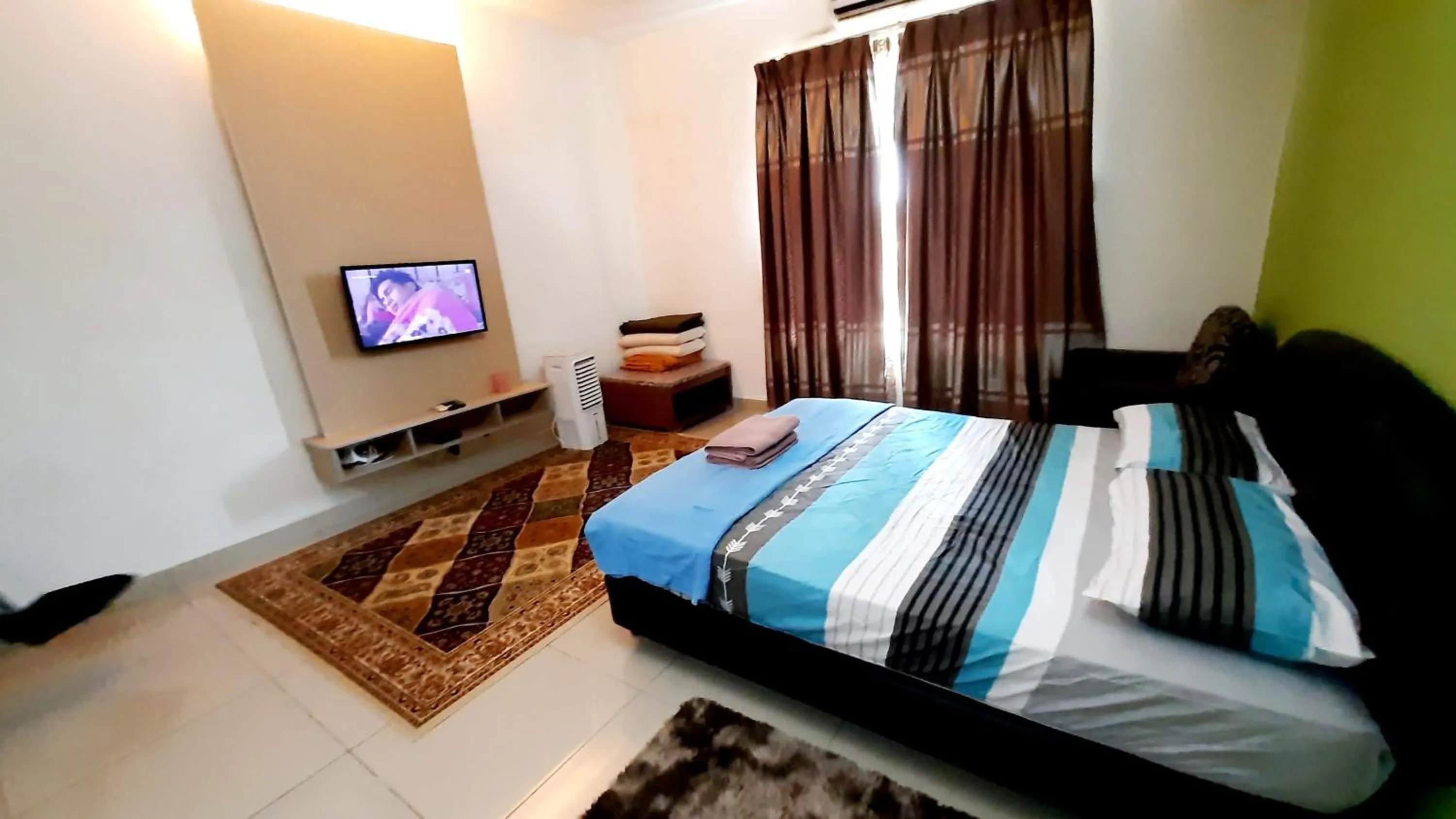 Bed in De Viana Apartments Homestay