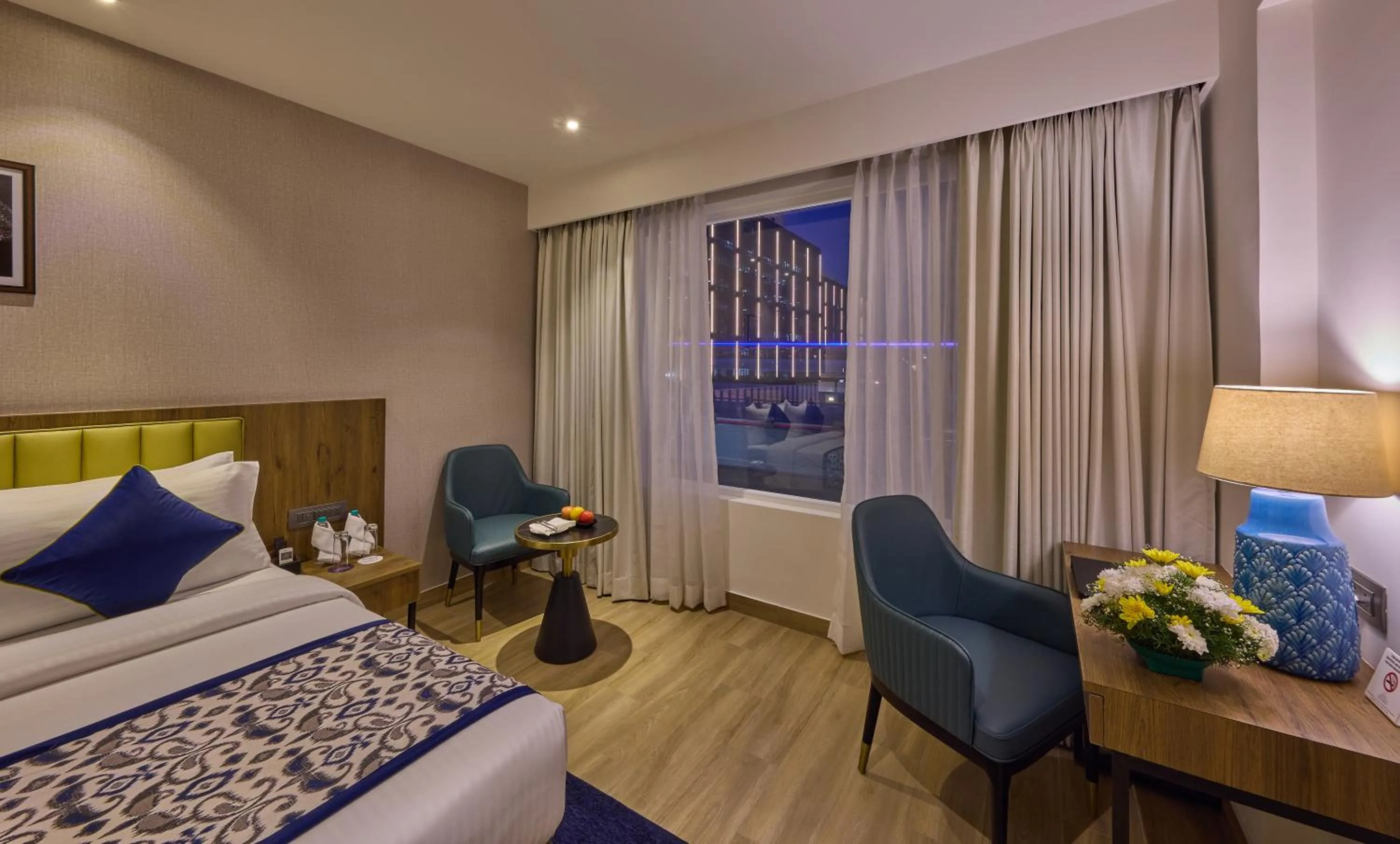 Bedroom, Bed in Grand Continent Hebbal A Sarovar Portico Affiliate Hotel