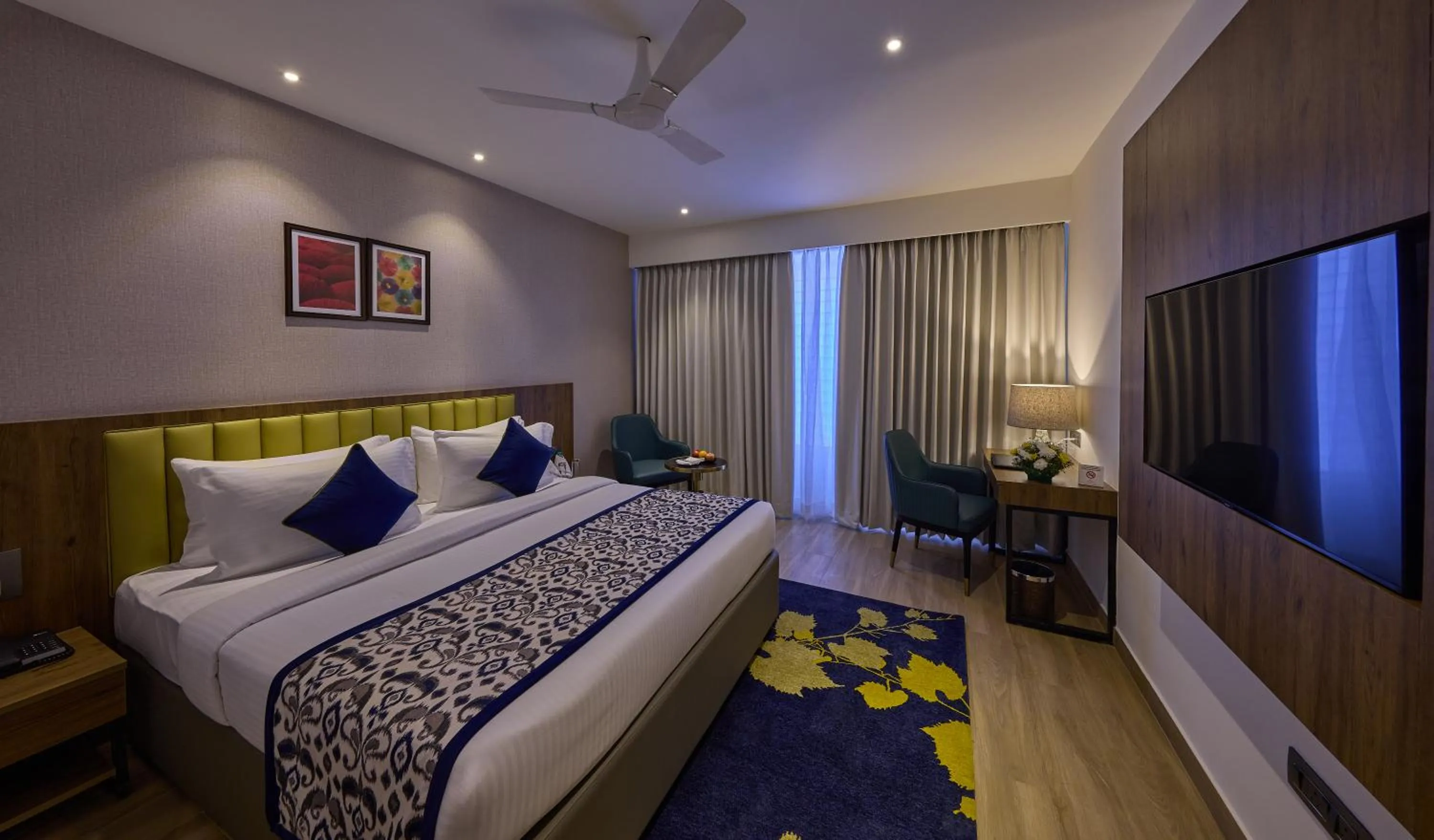 Bedroom, Bed in Grand Continent Hebbal A Sarovar Portico Affiliate Hotel