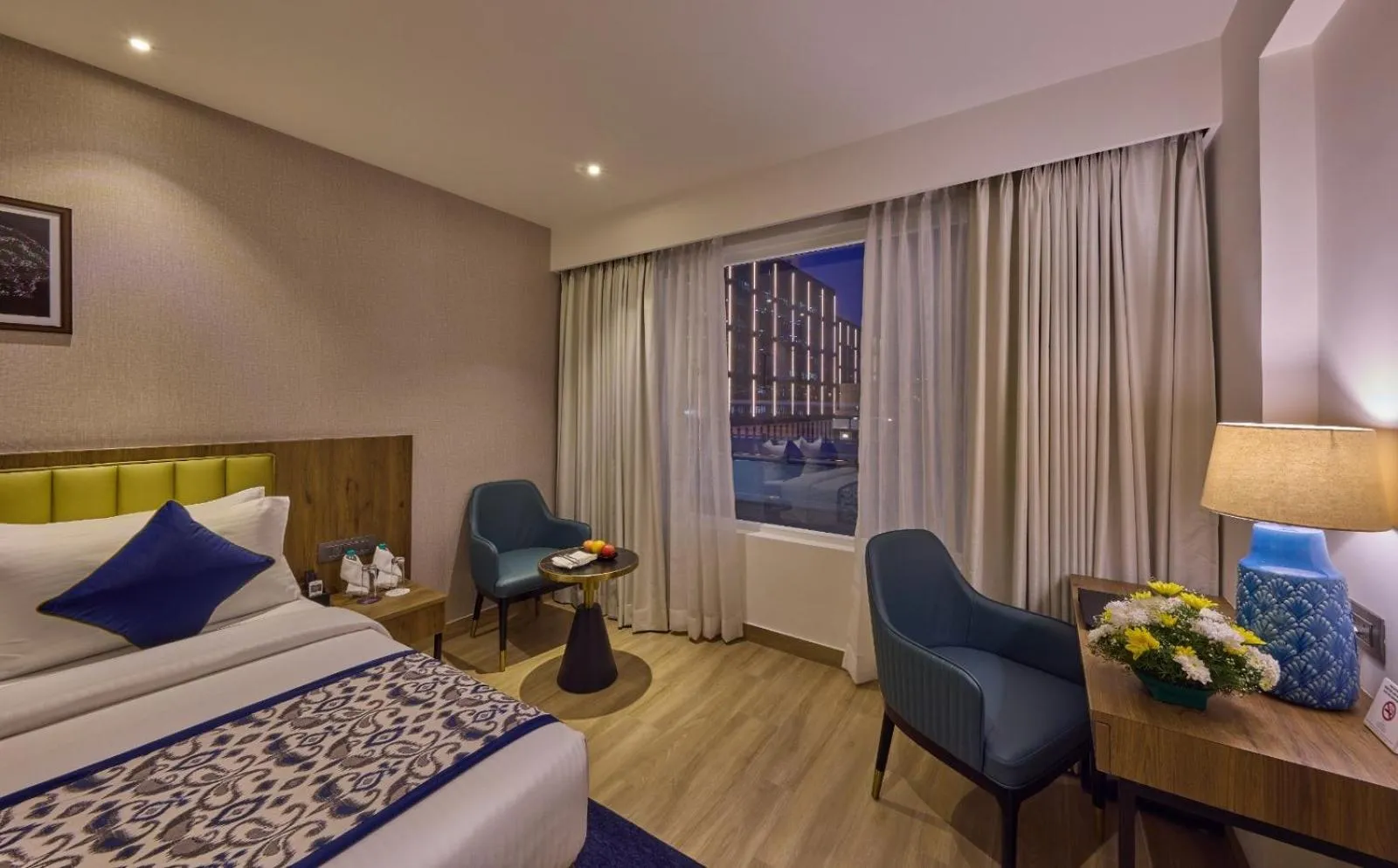 Bed in Grand Continent Hebbal A Sarovar Portico Affiliate Hotel