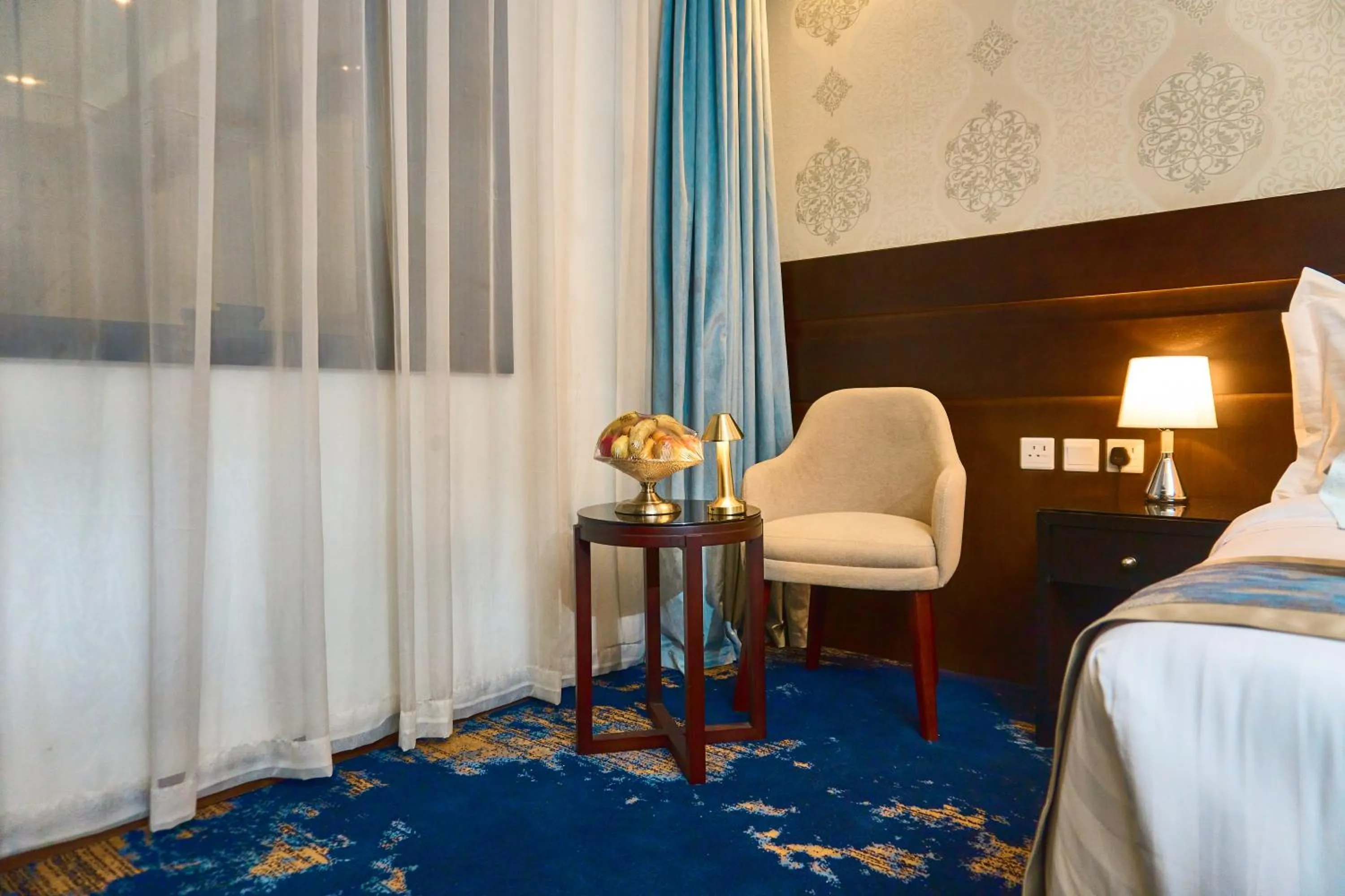 Seating area, Bed in Selat Al Bait Hotel