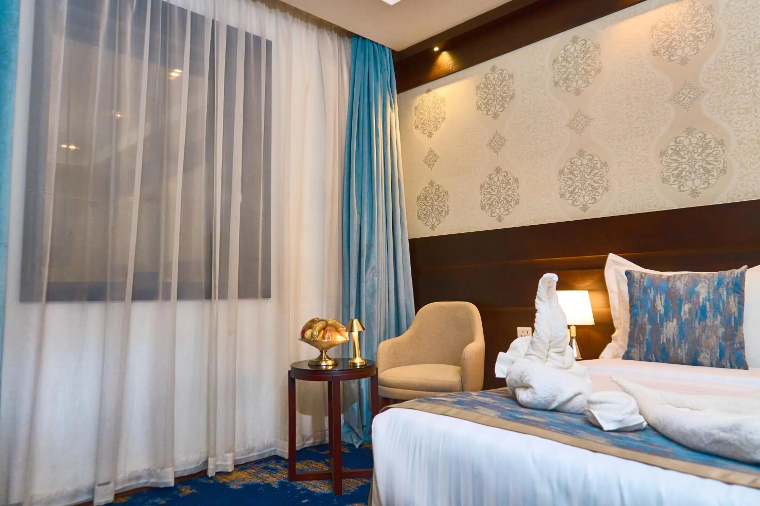 Seating area, Bed in Selat Al Bait Hotel