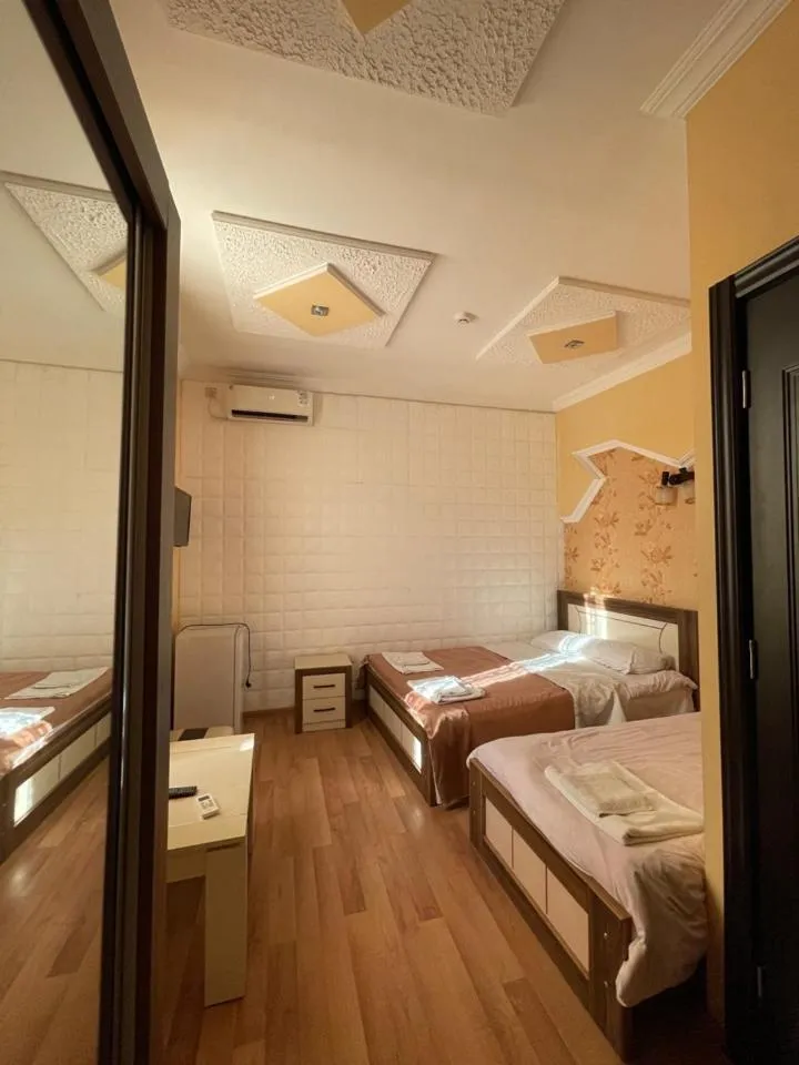 Bed in Lux Palace Hotel