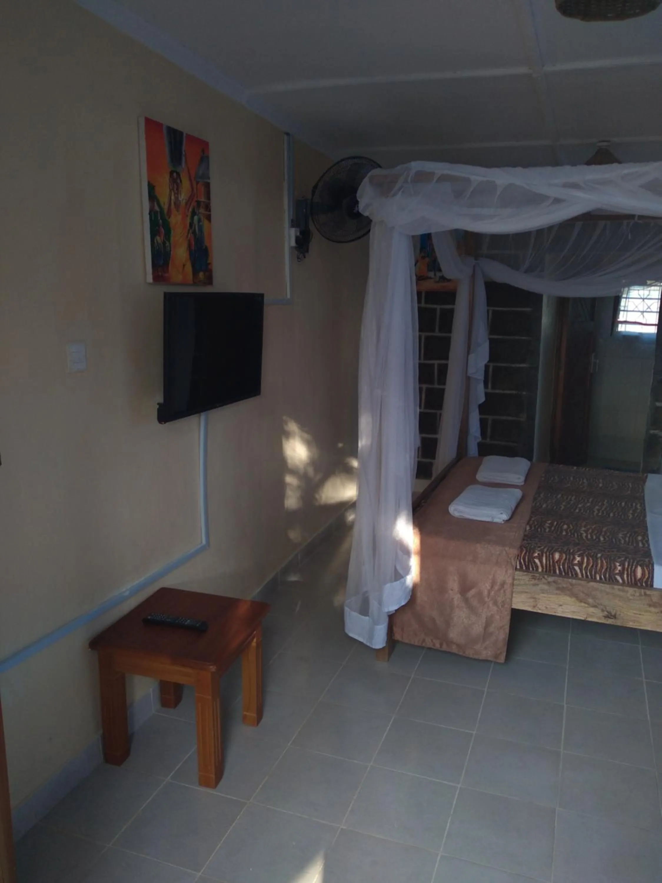 Communal lounge/ TV room, Bed in Ocean View Nyali Boutique Hotel