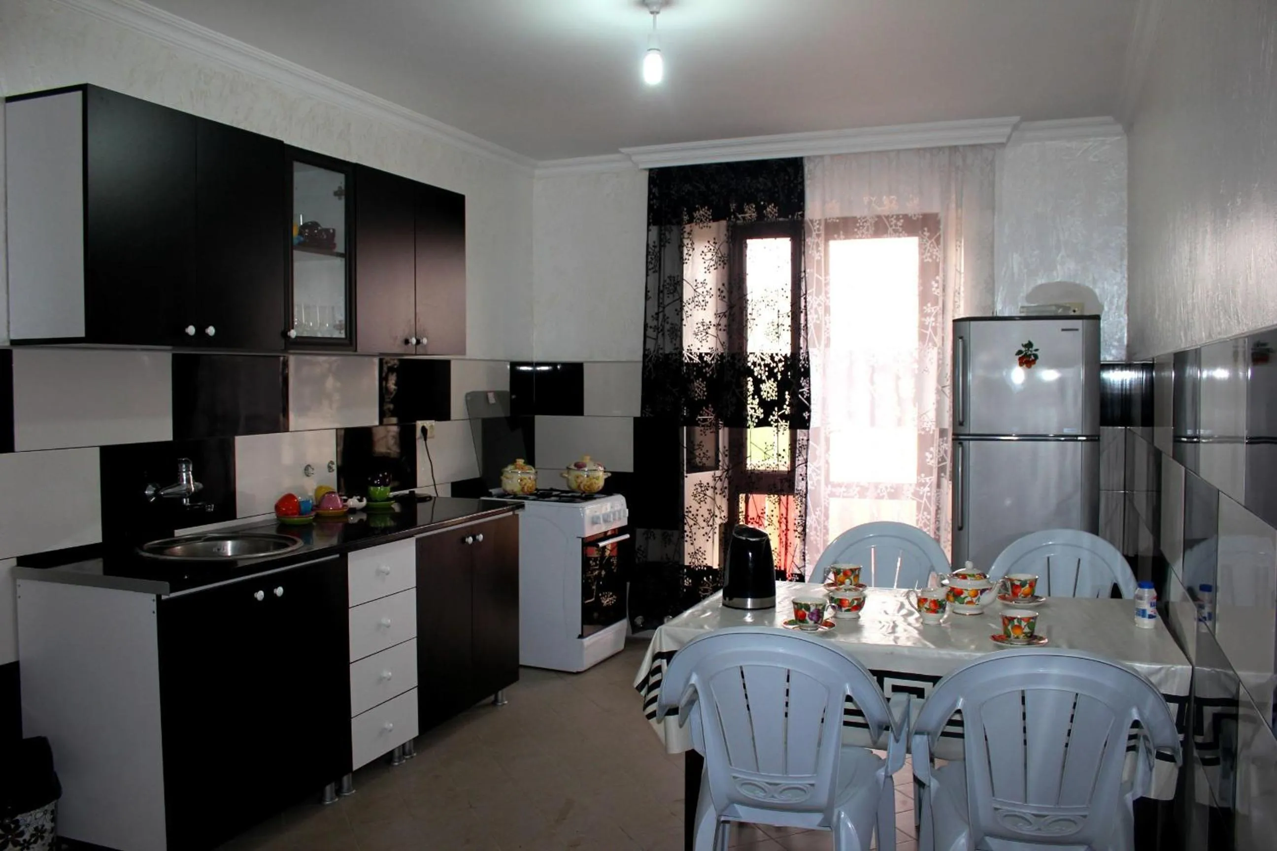 Communal kitchen in Sunrise Hotel