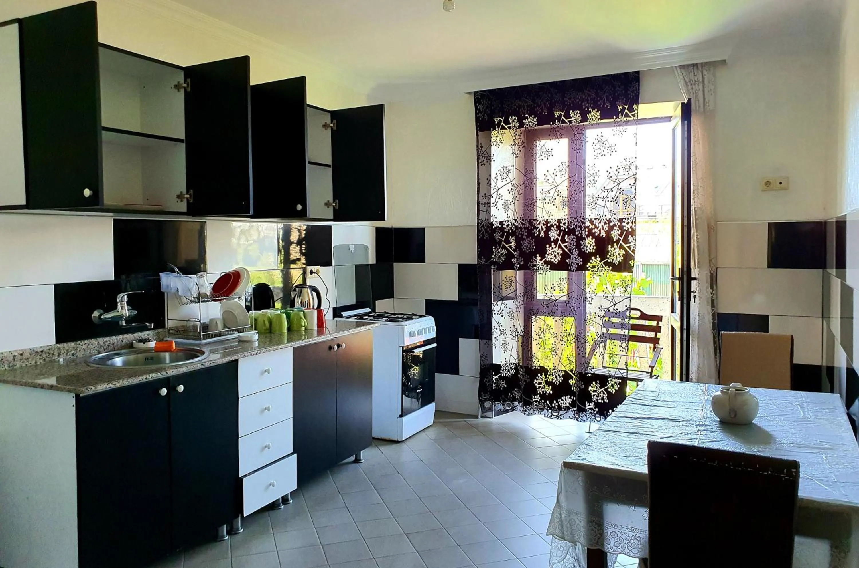 Communal kitchen in Sunrise Hotel