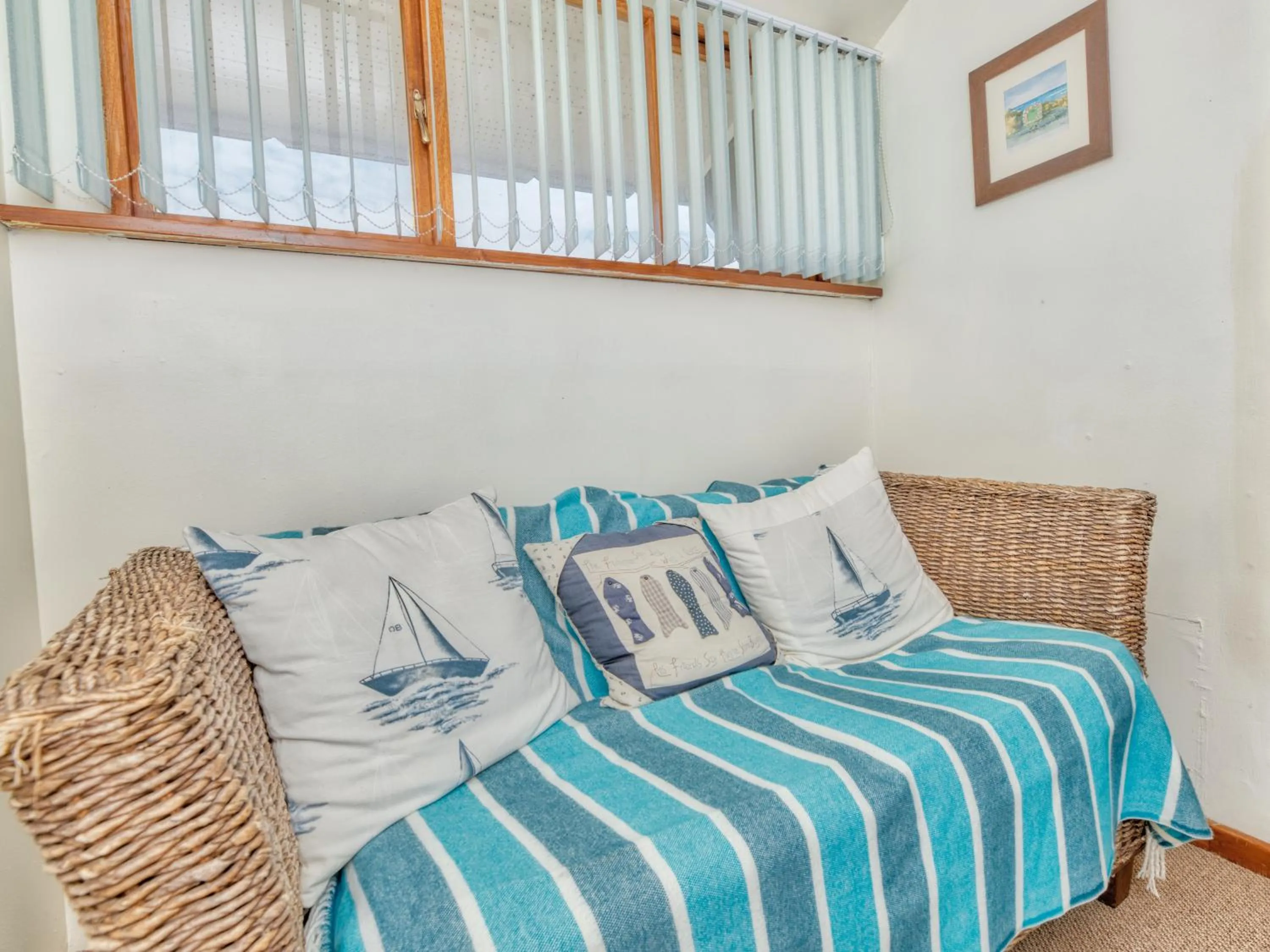 Seating area, Bed in Mermaid Guest House