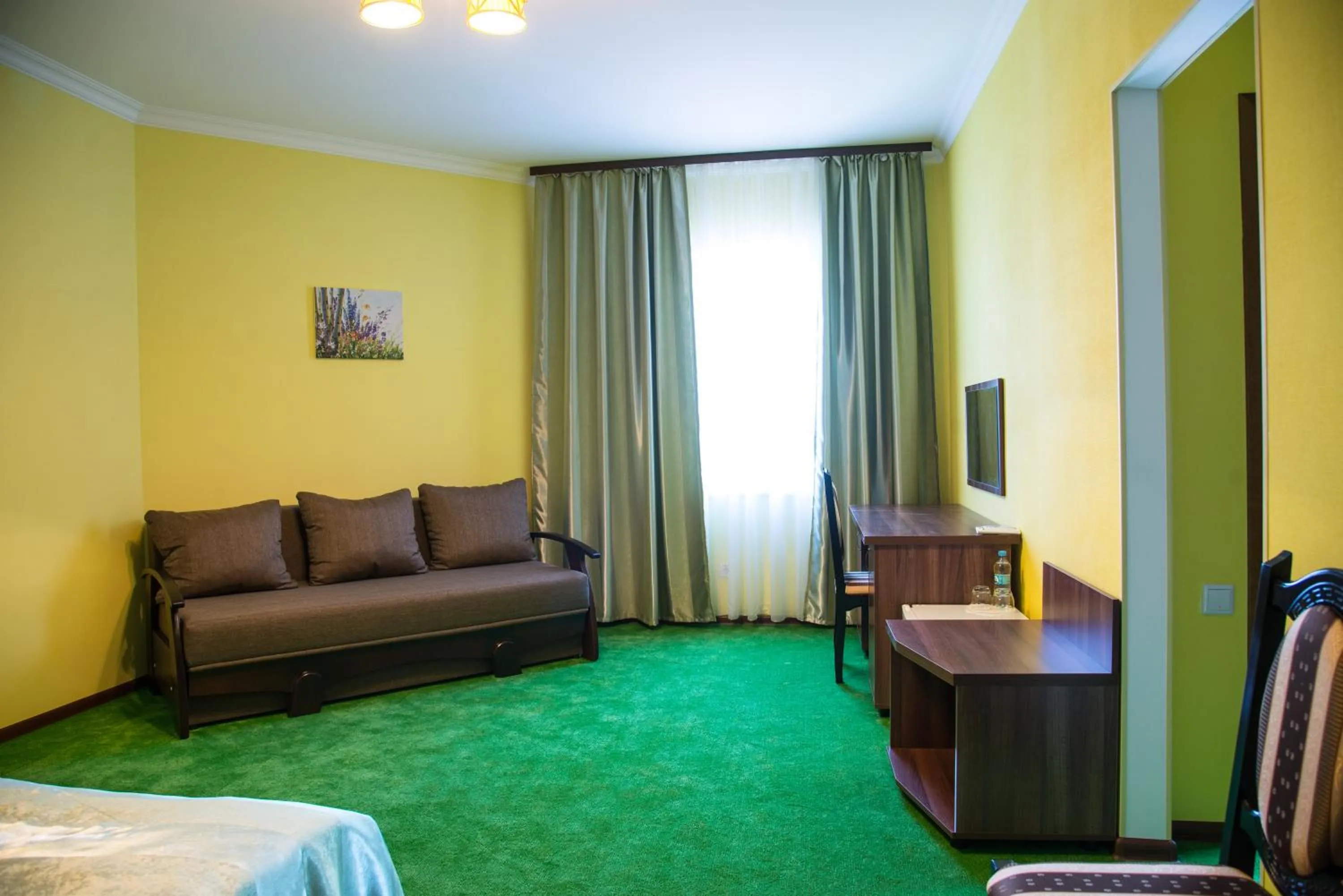 Seating area, Bed in 12 Months Mini Hotel