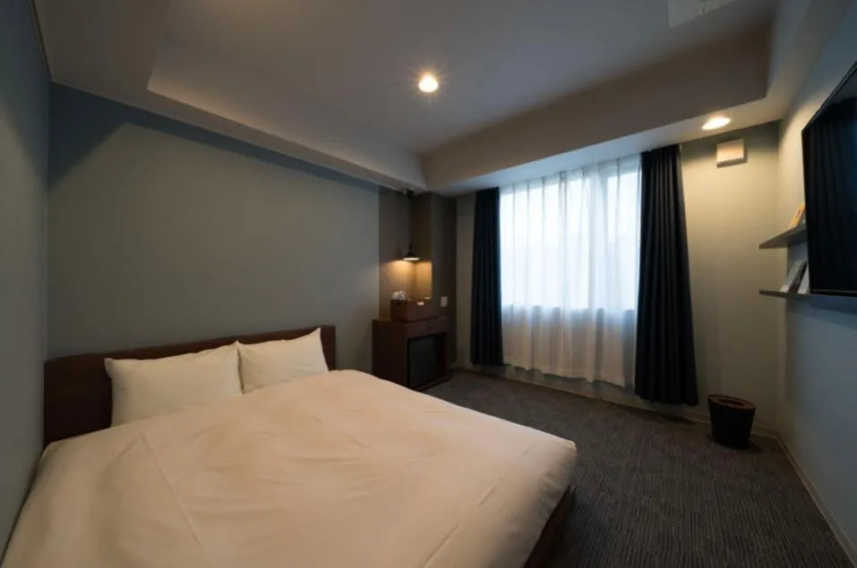 Bed in BOOK HOTEL Kyoto KUJYO