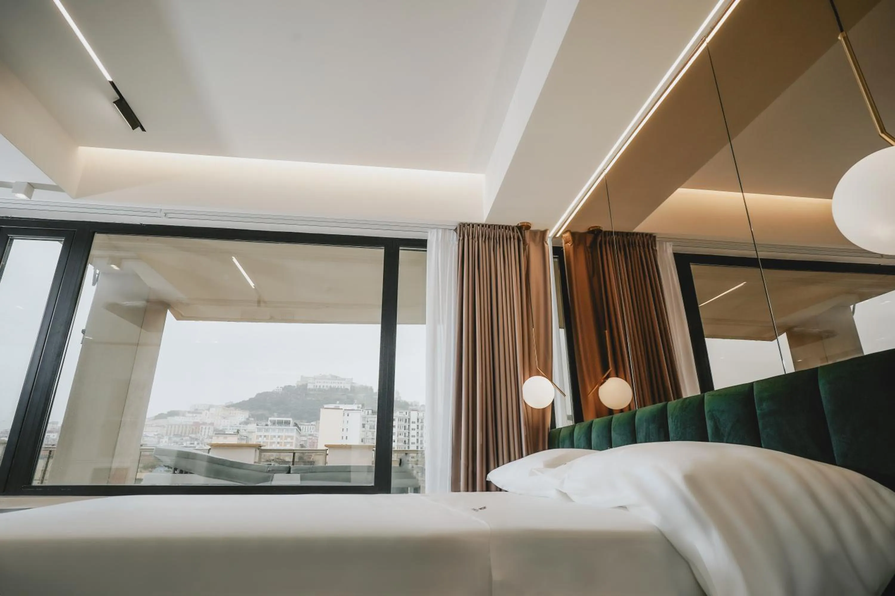 Bed in POETICA BOUTIQUE SKY HOTEL