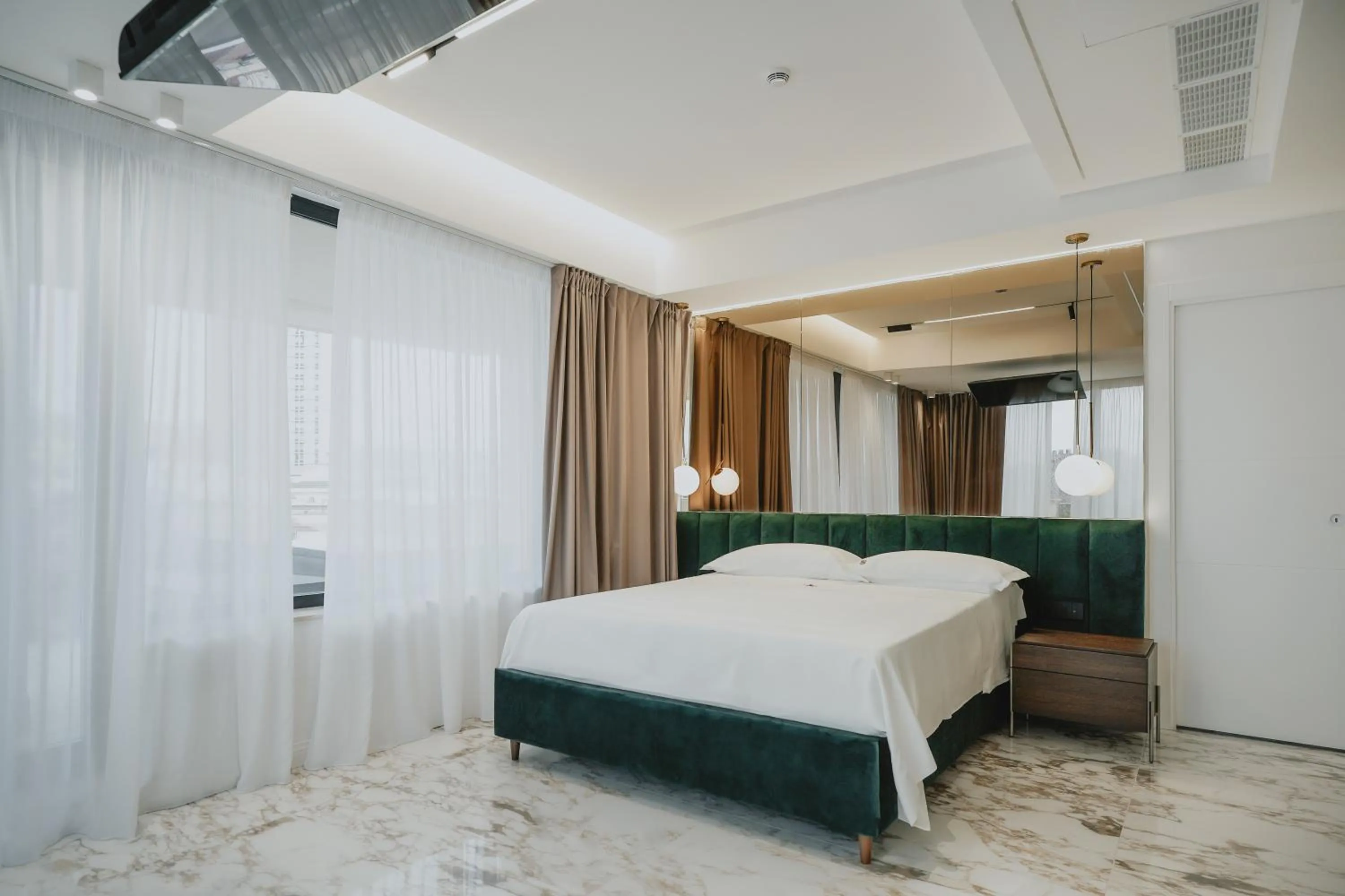 Bed in POETICA BOUTIQUE SKY HOTEL