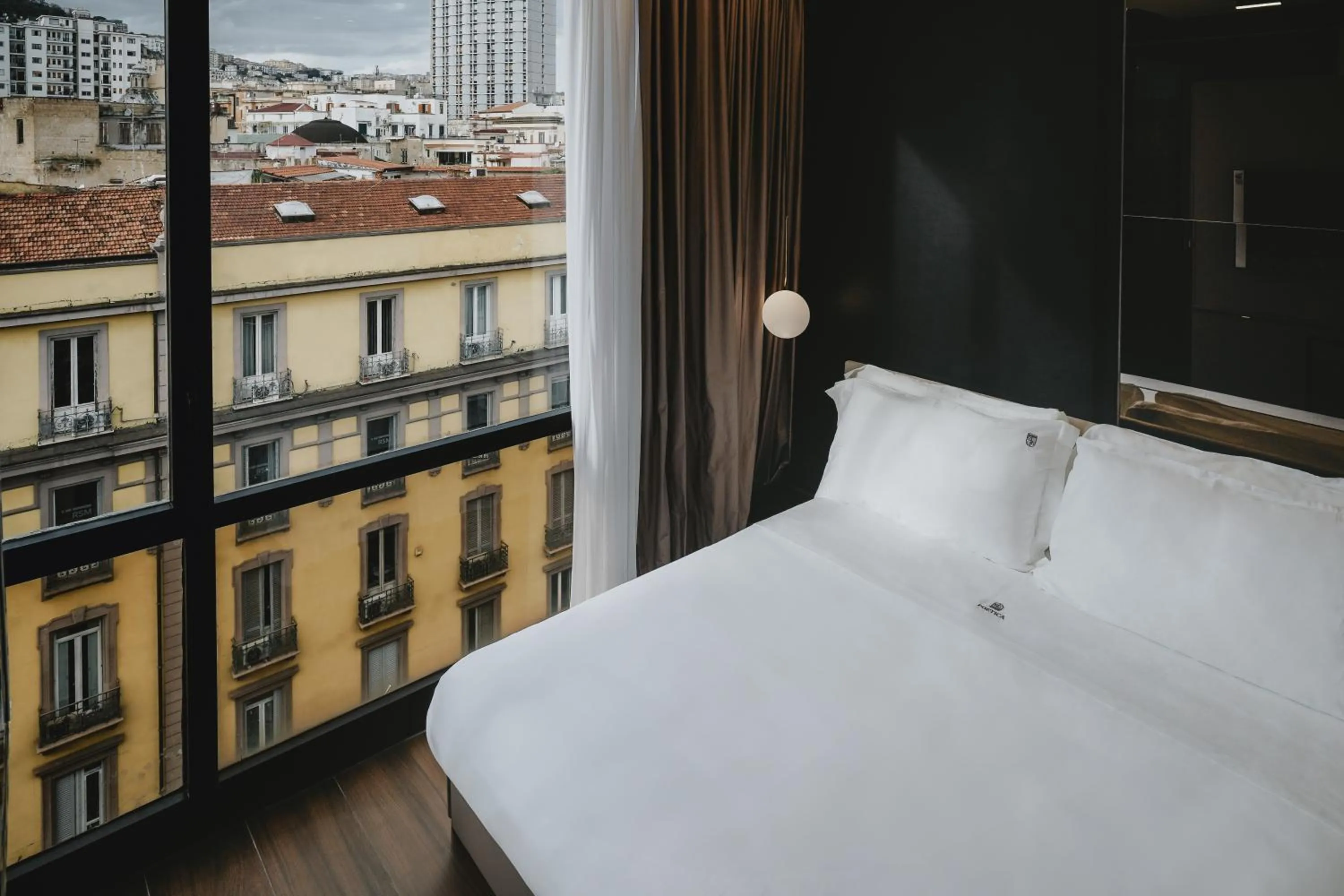 Bed in POETICA BOUTIQUE SKY HOTEL