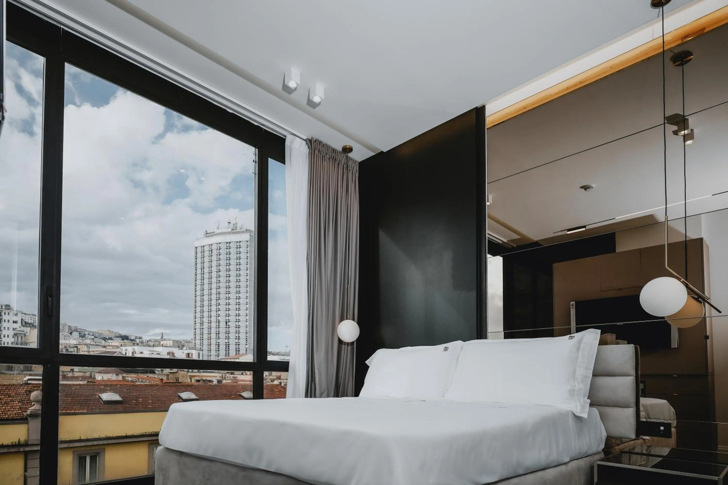 Bed in POETICA BOUTIQUE SKY HOTEL