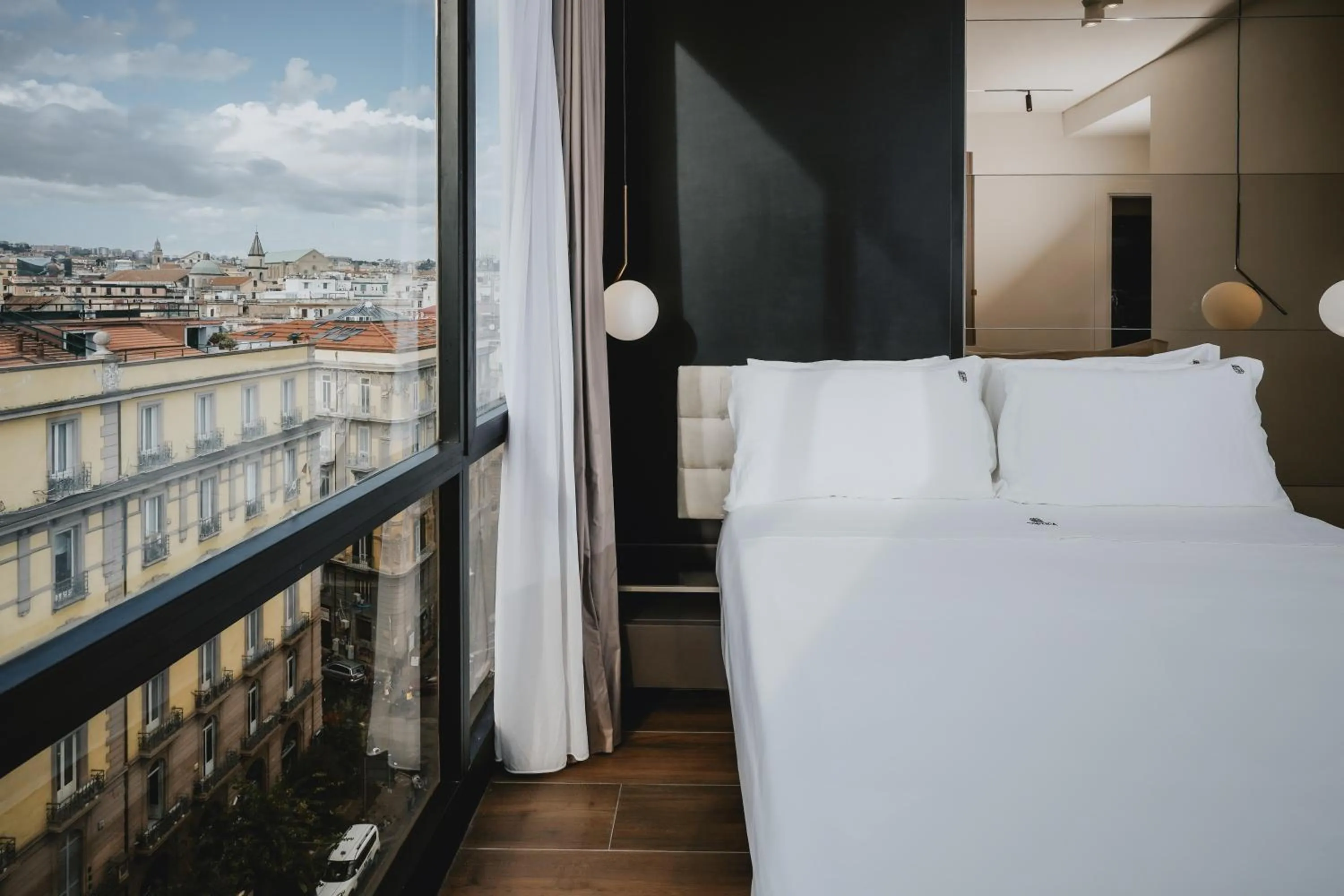 Bed in POETICA BOUTIQUE SKY HOTEL