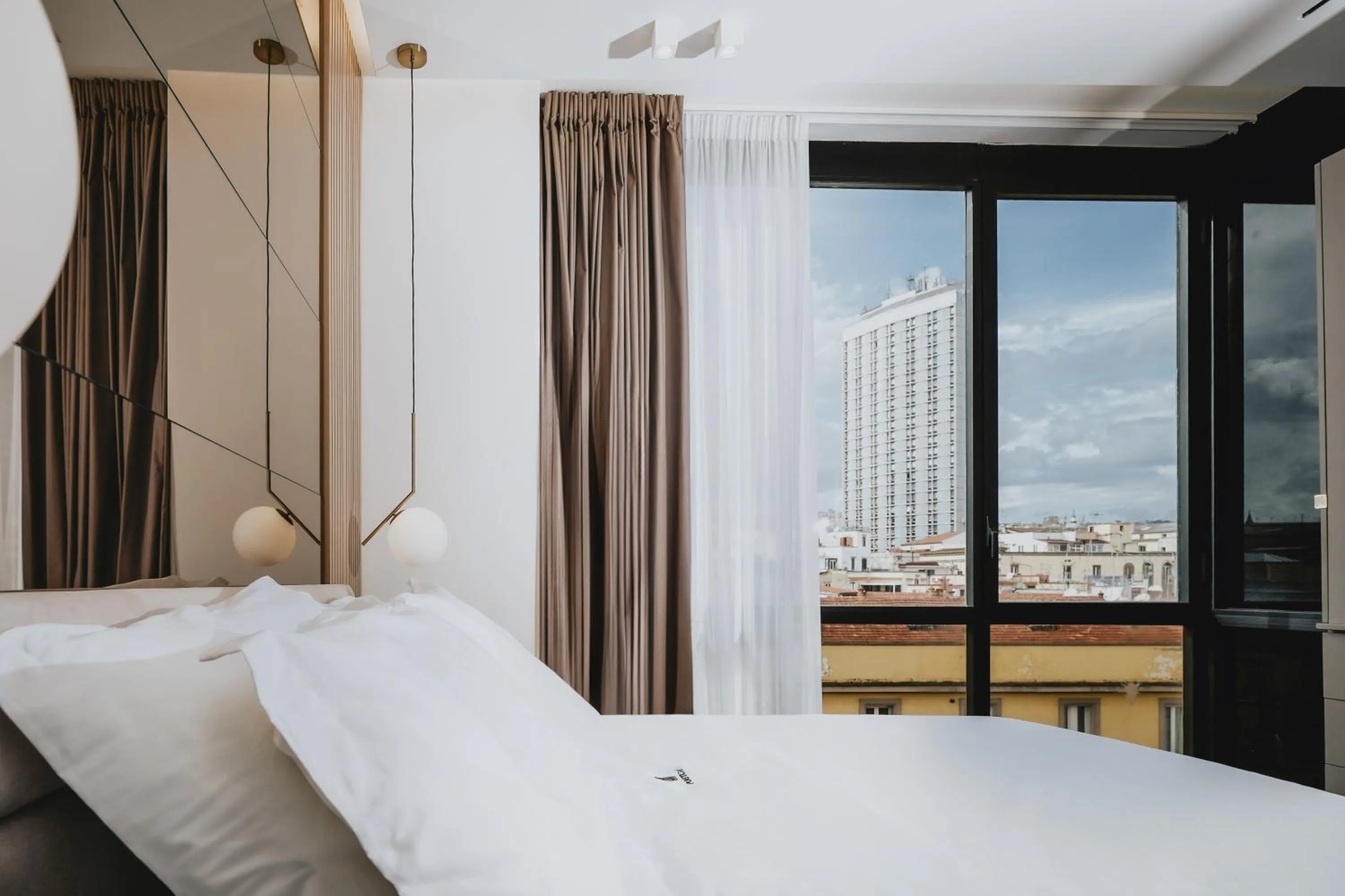 Bed in POETICA BOUTIQUE SKY HOTEL