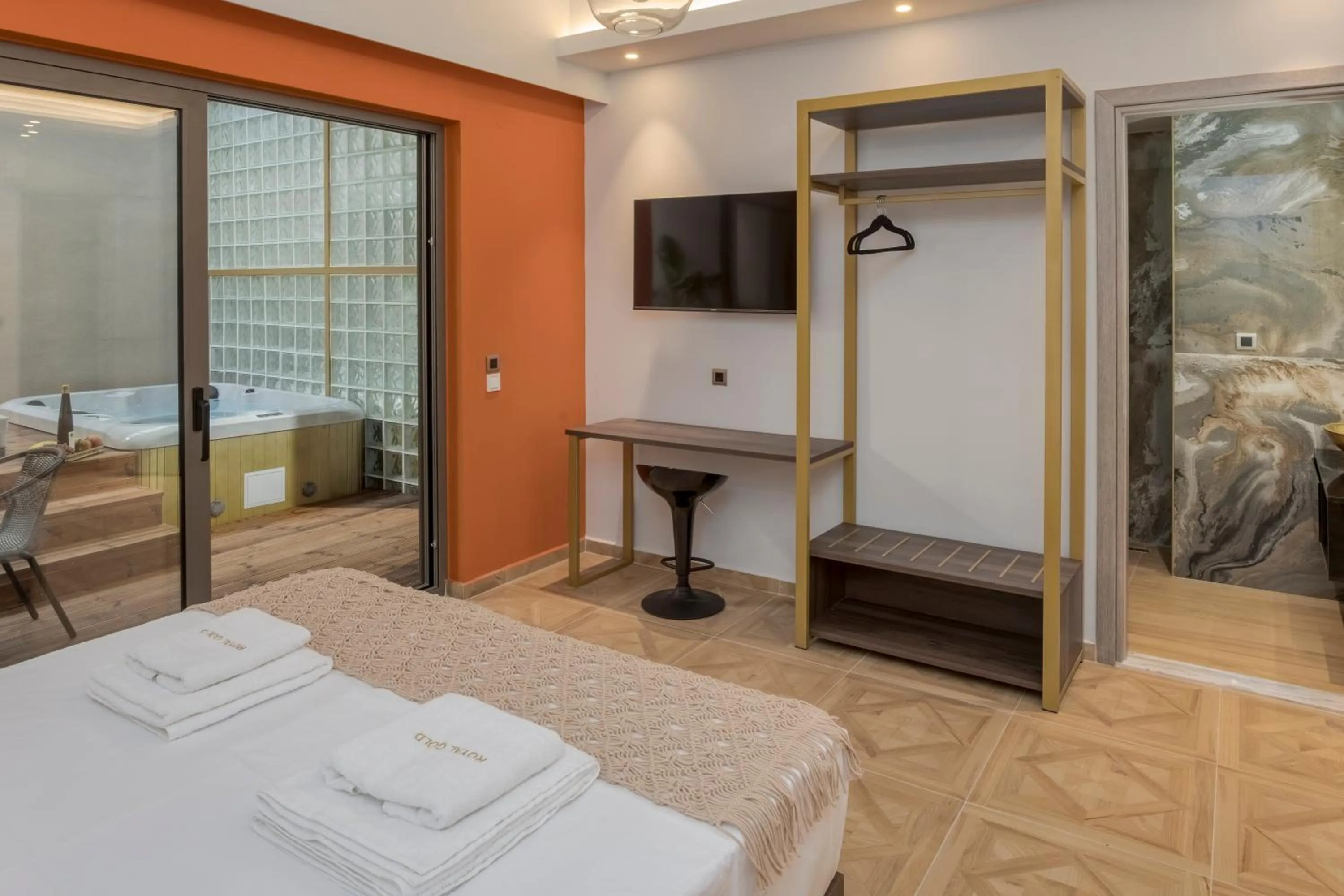 Bed in Royal Gold City Suites by Omilos Hotels