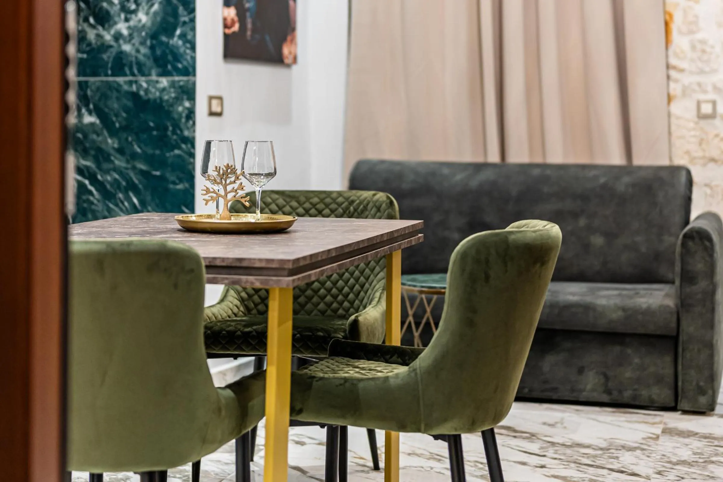 Living room in Royal Gold City Suites by Omilos Hotels