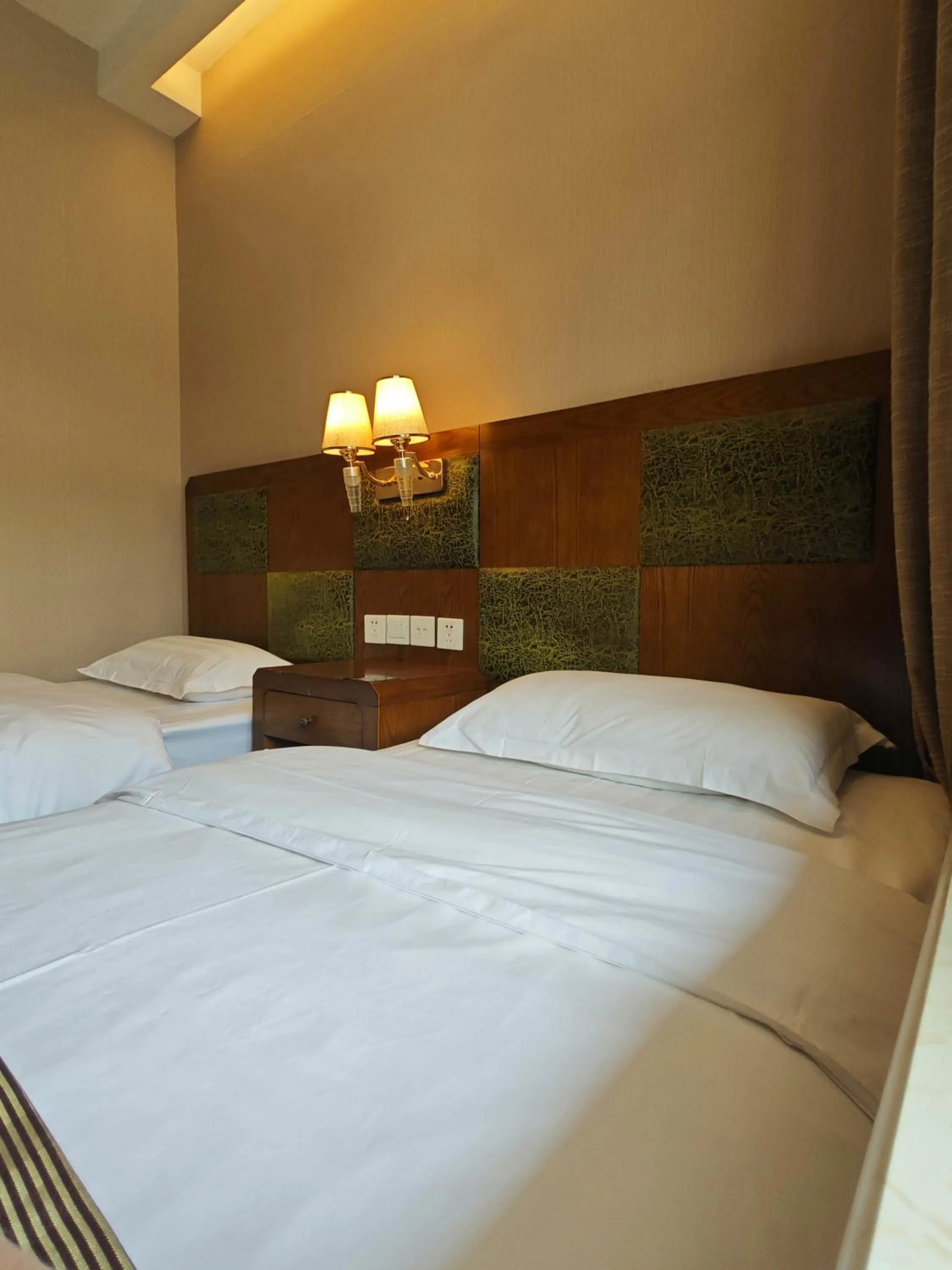 Bed in Beijing Huiqing Garden Bussiness Hotel