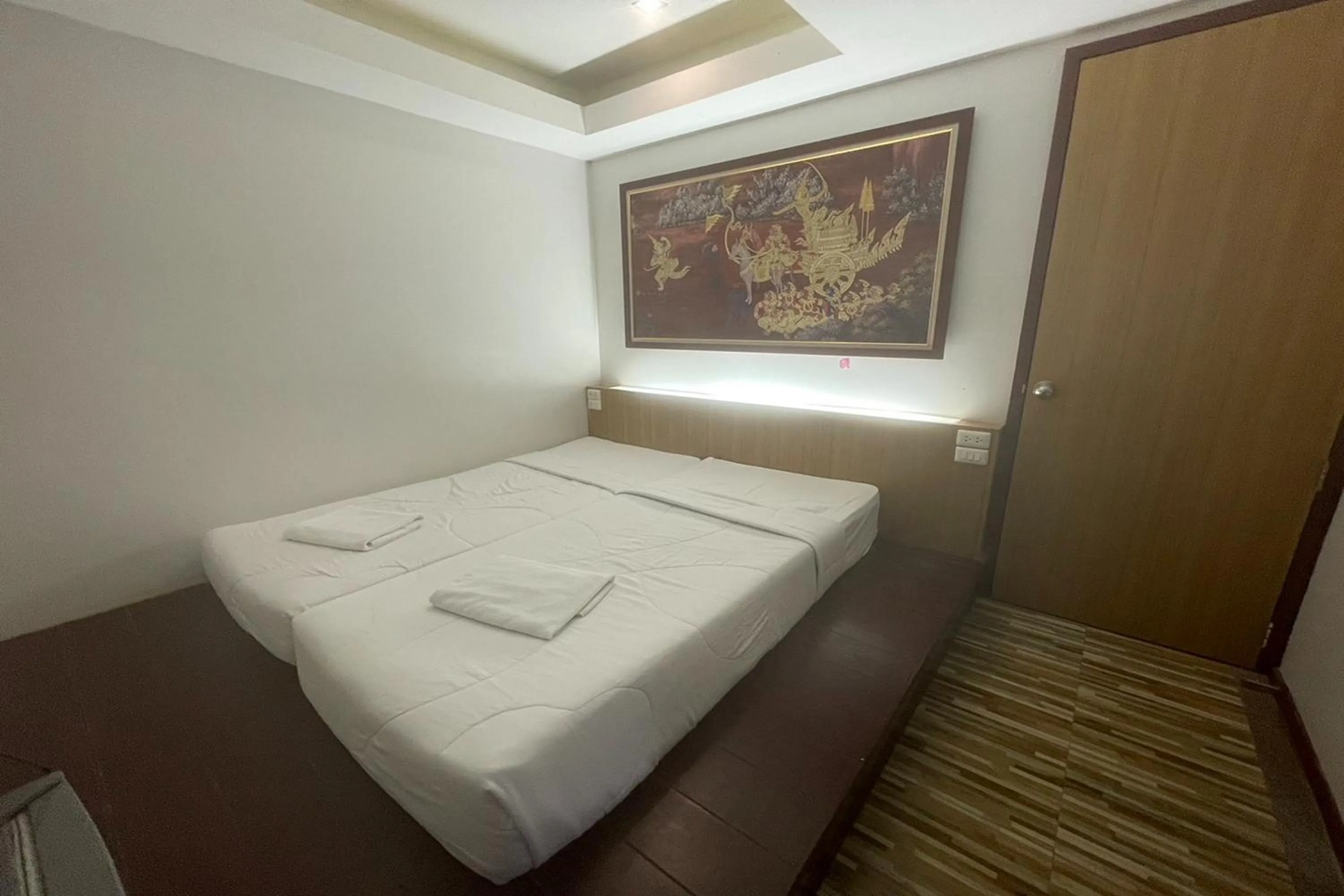 Bed in Landmark Patong Hotel
