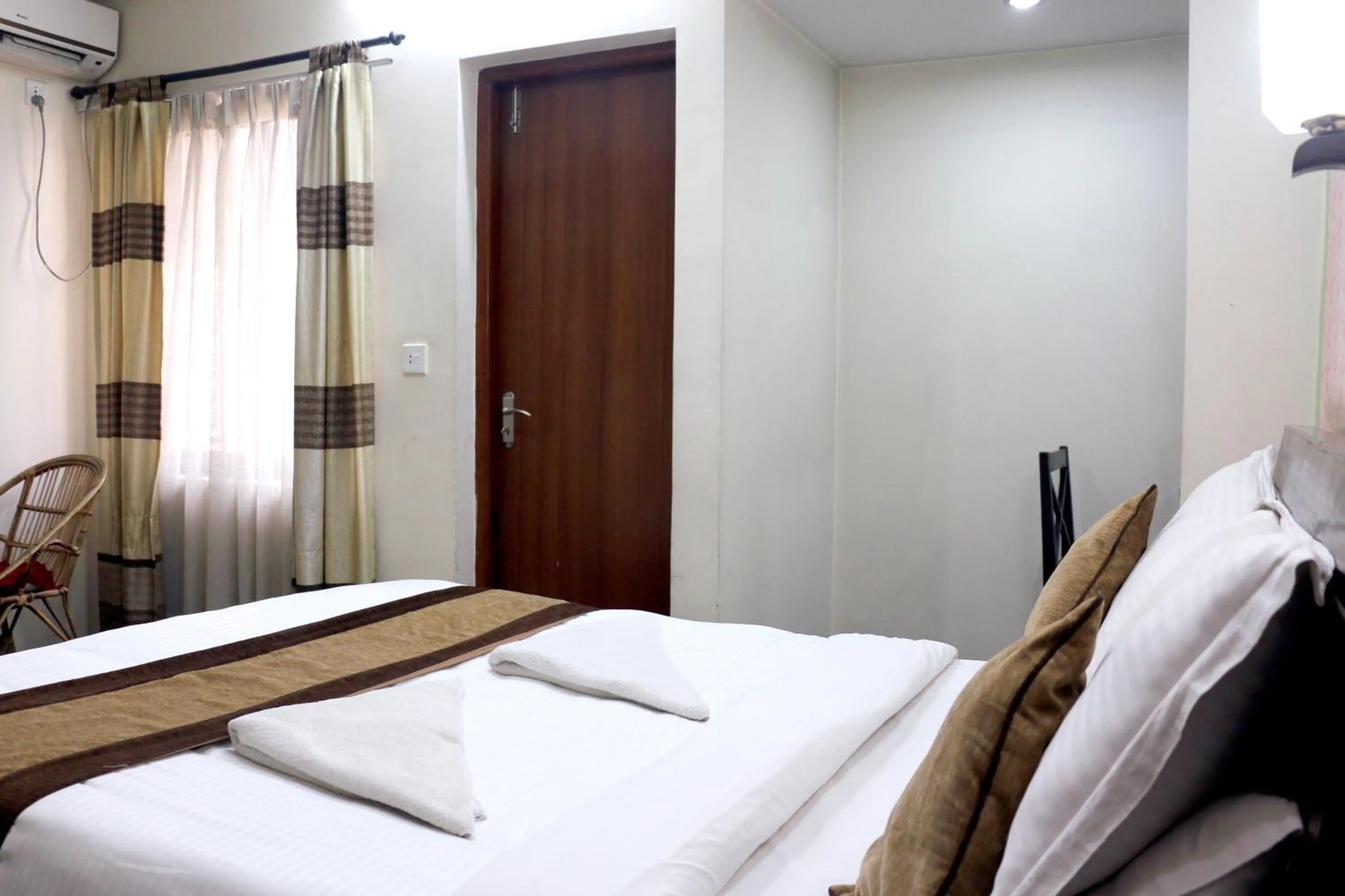 Bedroom in Alpine Hotel & Apartment