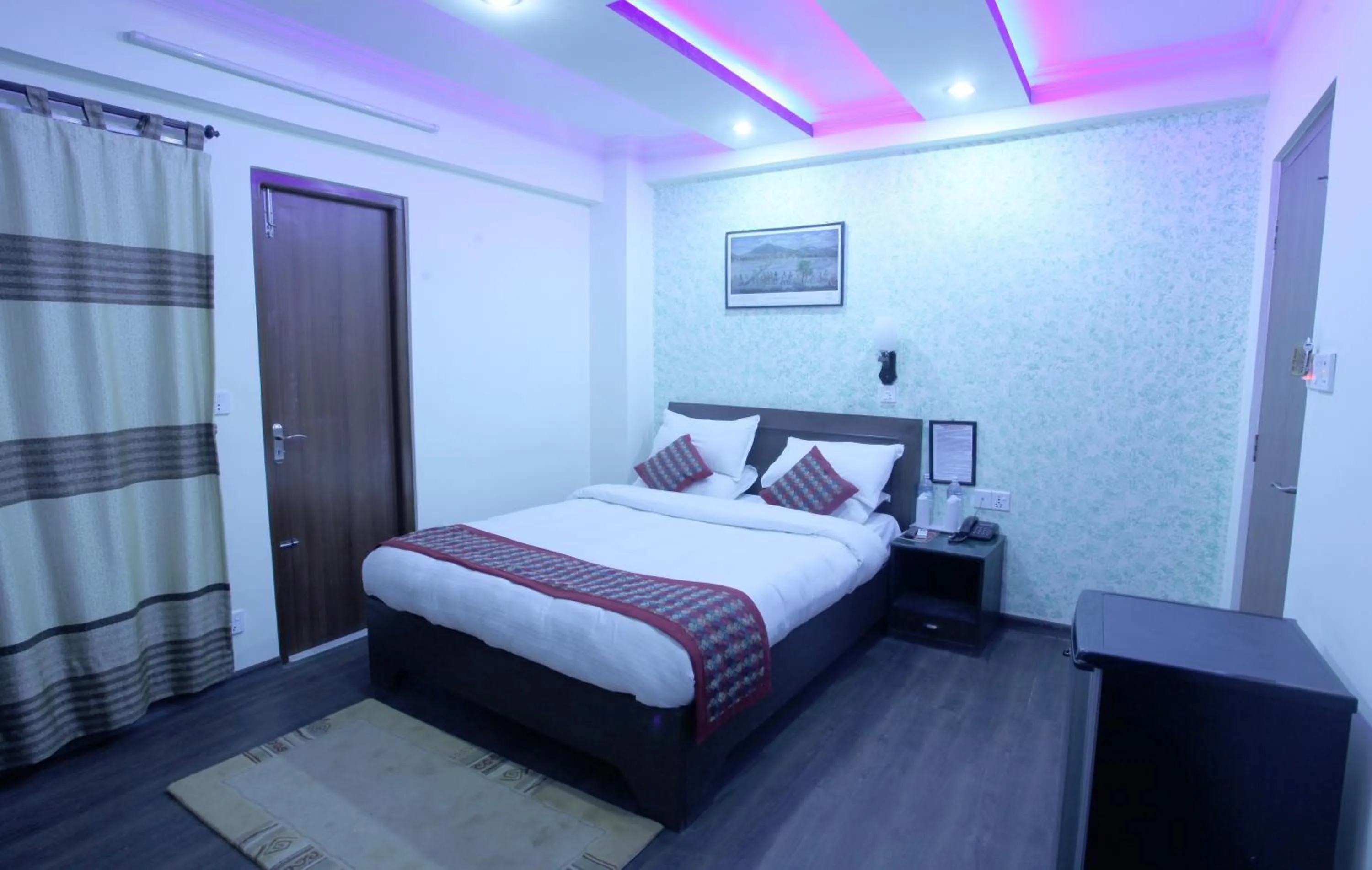 Bed in Alpine Hotel & Apartment