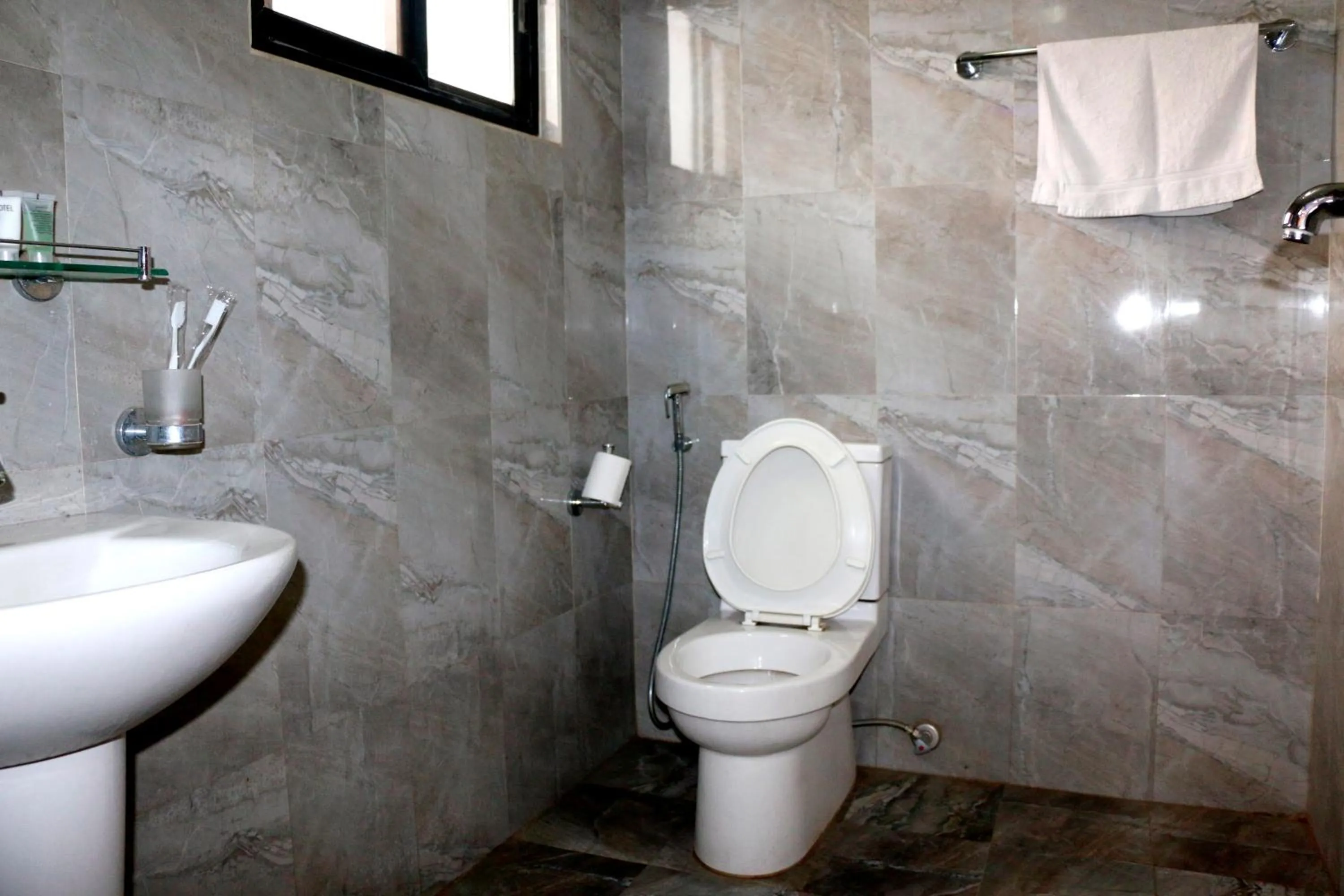 Bathroom in Alpine Hotel & Apartment
