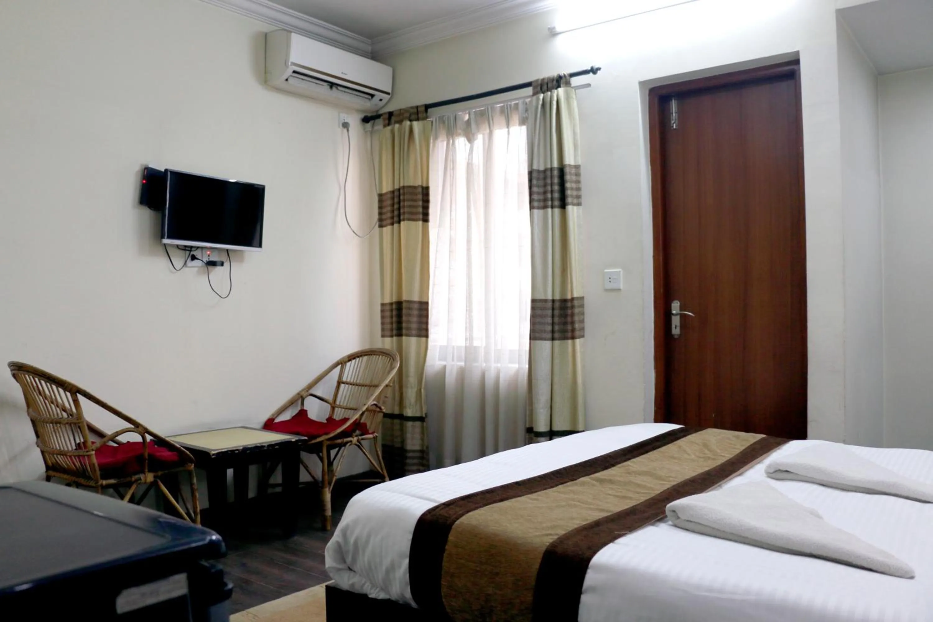 Bedroom in Alpine Hotel & Apartment