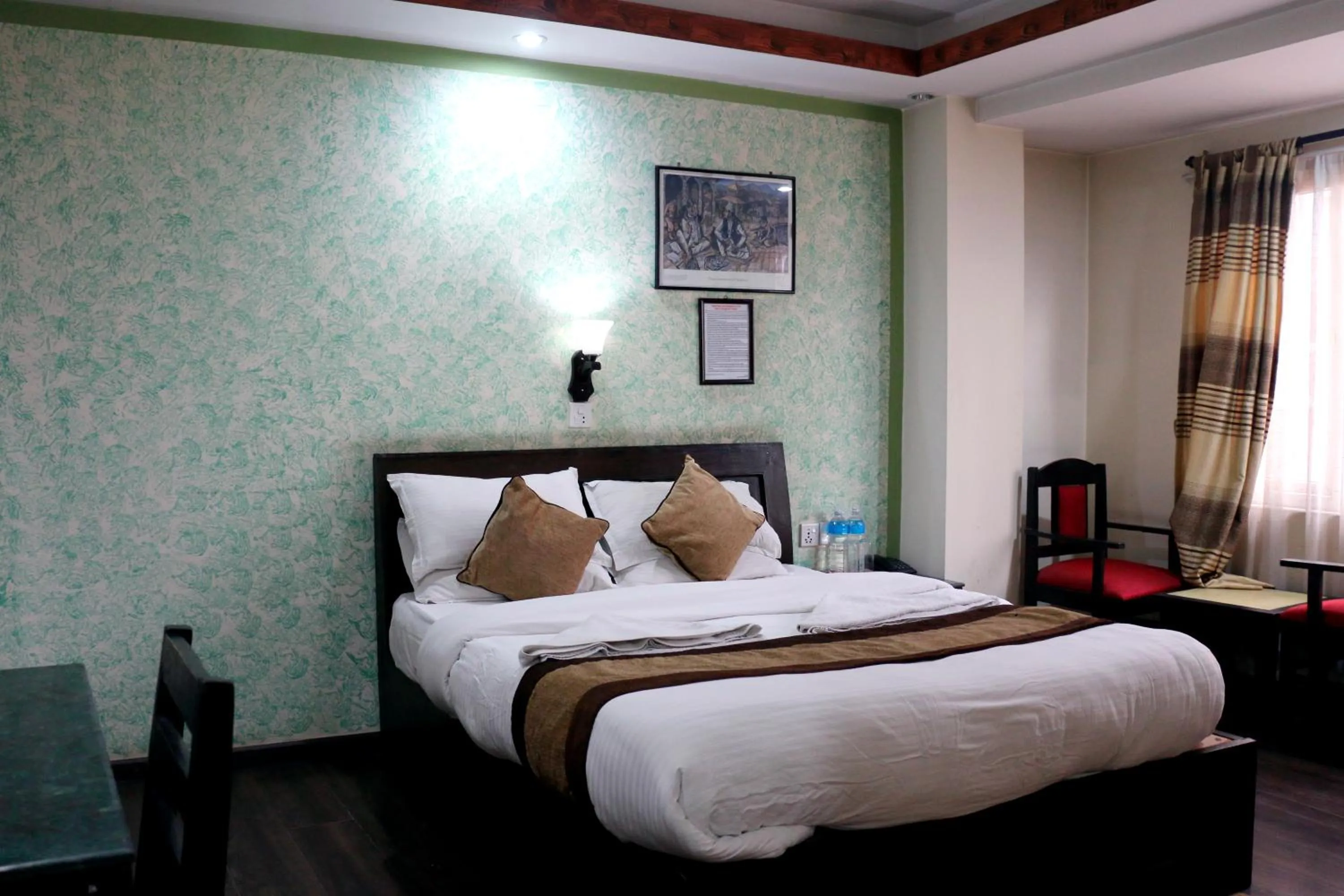 Bedroom in Alpine Hotel & Apartment