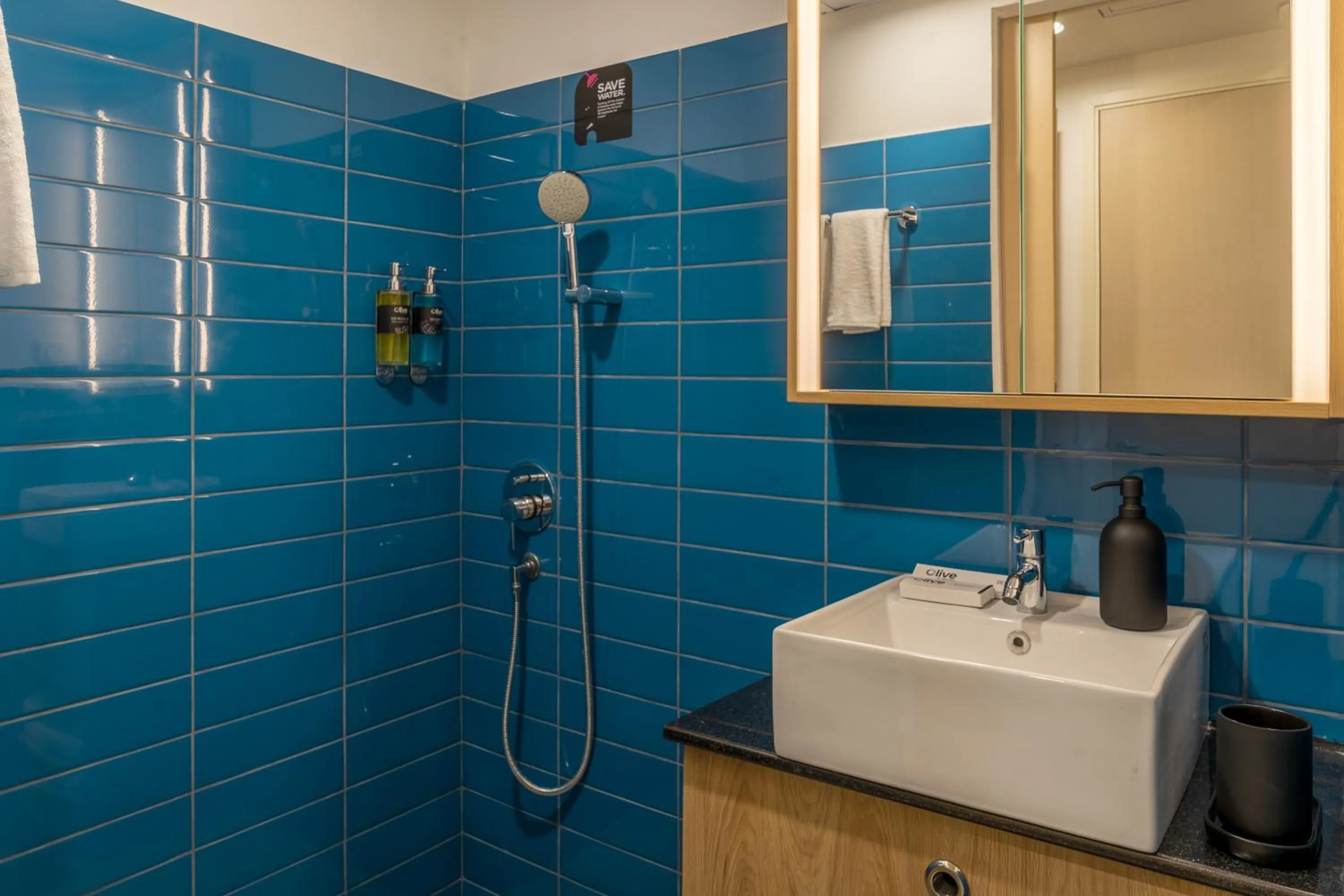 Bathroom in Olive Hotel Brookefield by Embassy Group