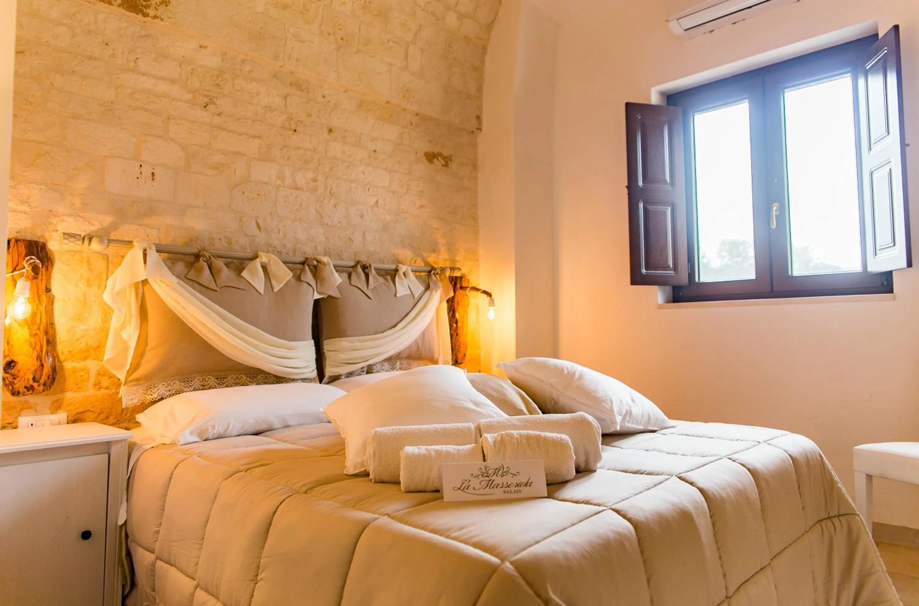 Bed in Relais La Masseriola
