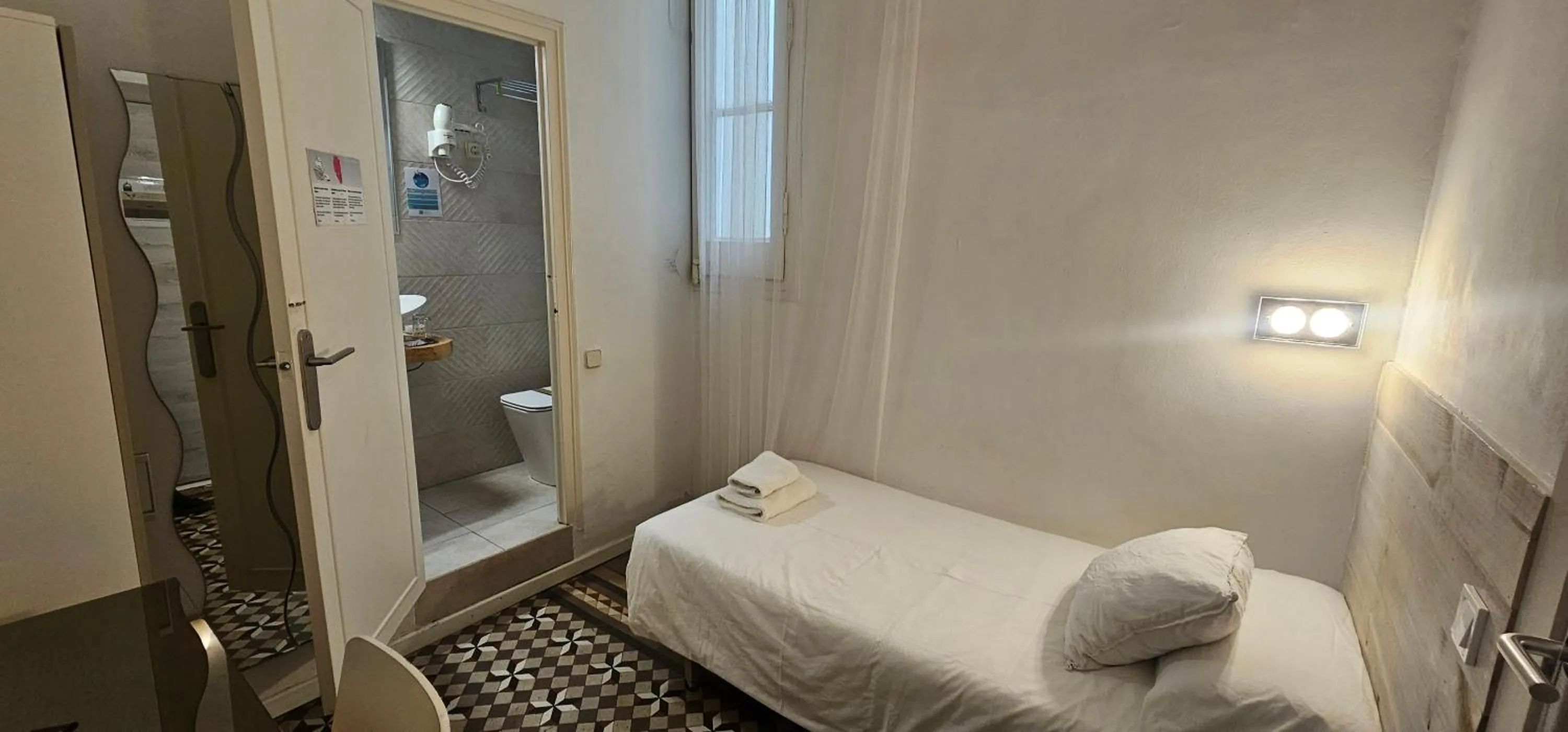 Photo of the whole room, Bed in Hostal Eixample