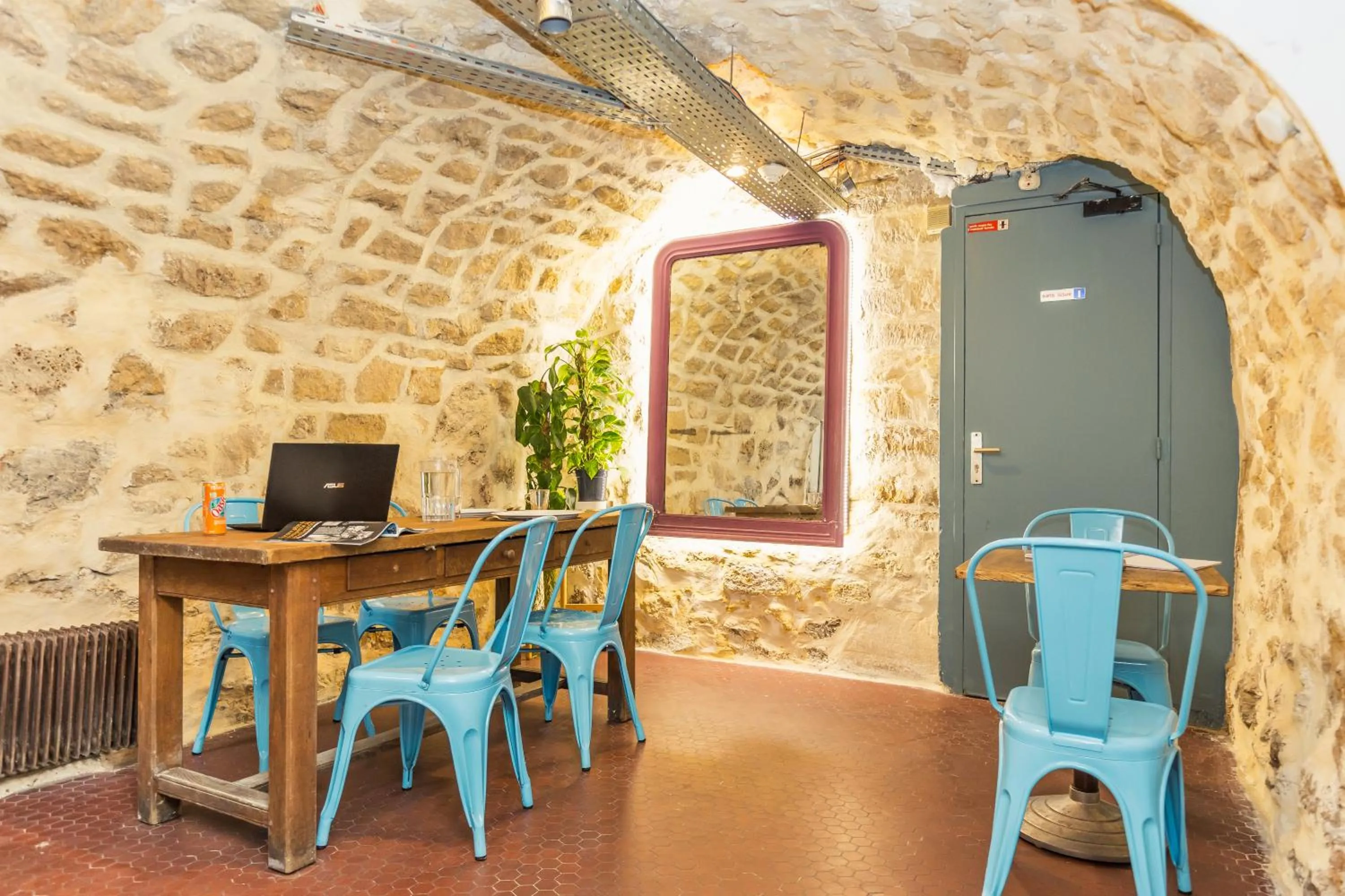 Seating area in Young and Happy Latin Quarter by Hiphophostels