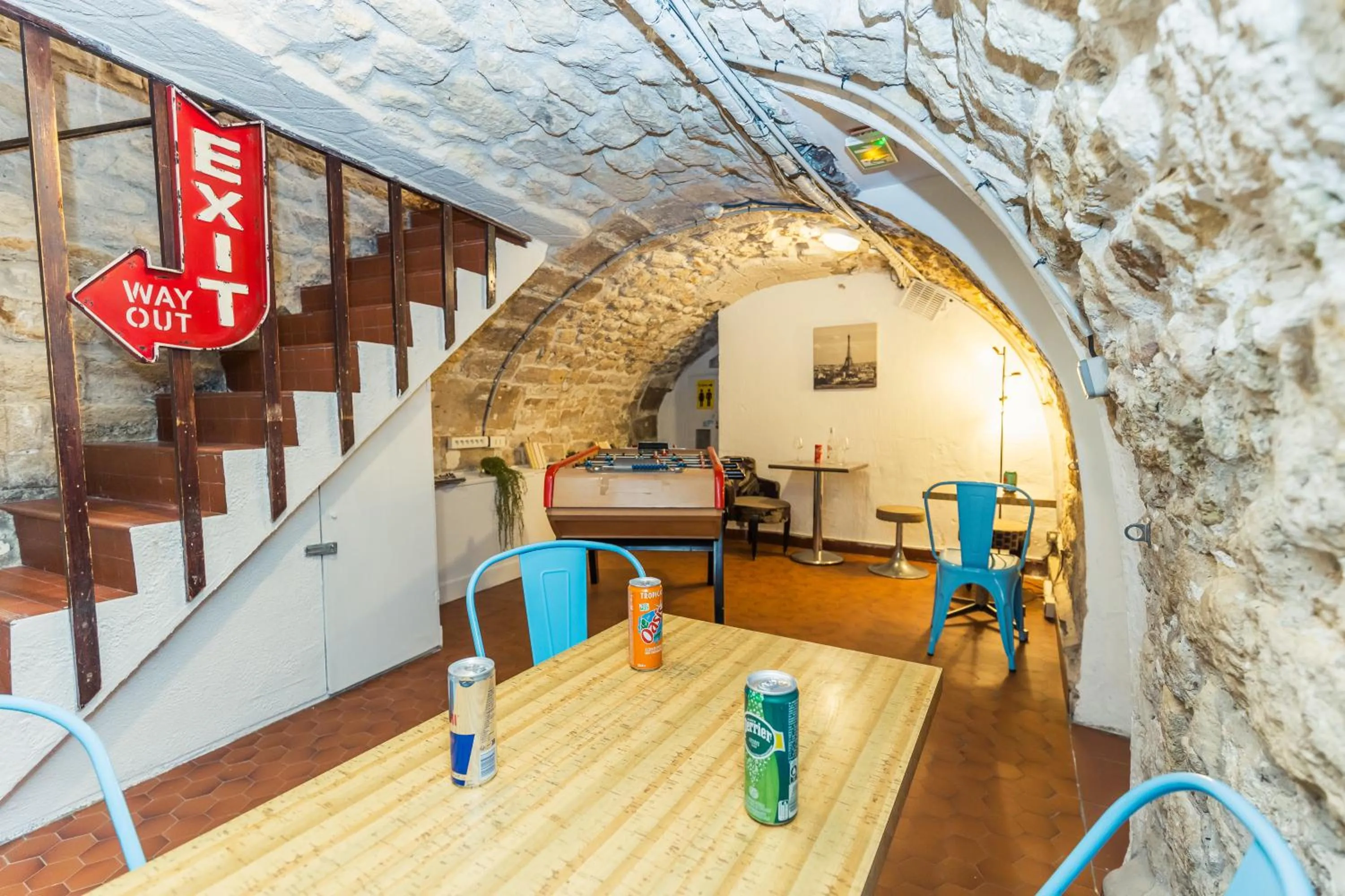 Seating area in Young and Happy Latin Quarter by Hiphophostels