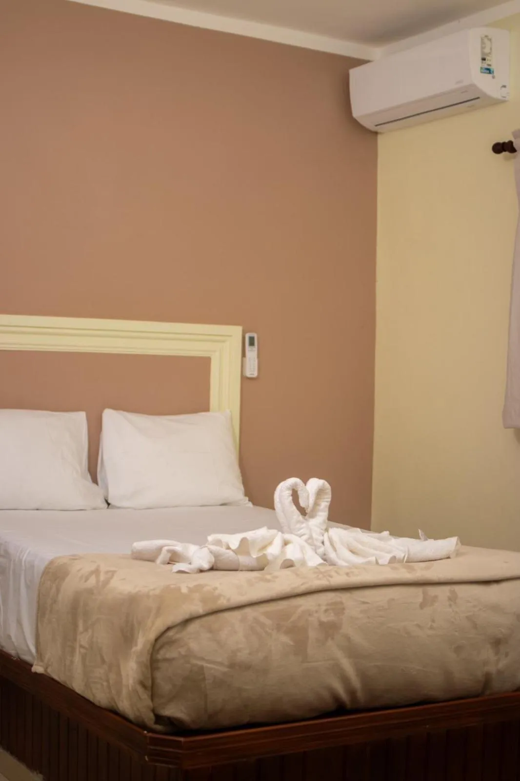 Bed in Diosamar Hotel y Suites