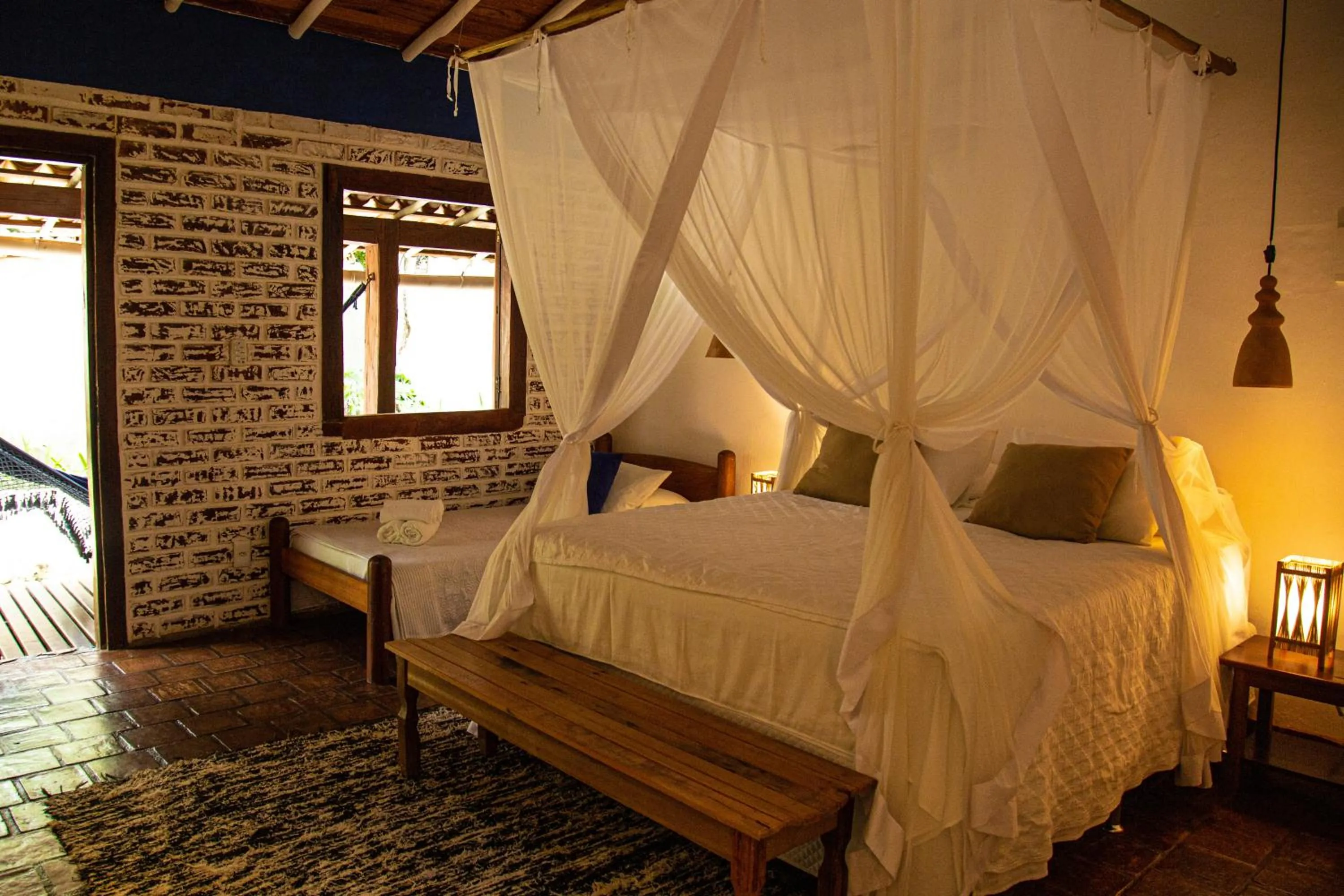 Bed in Pousada Le Refuge