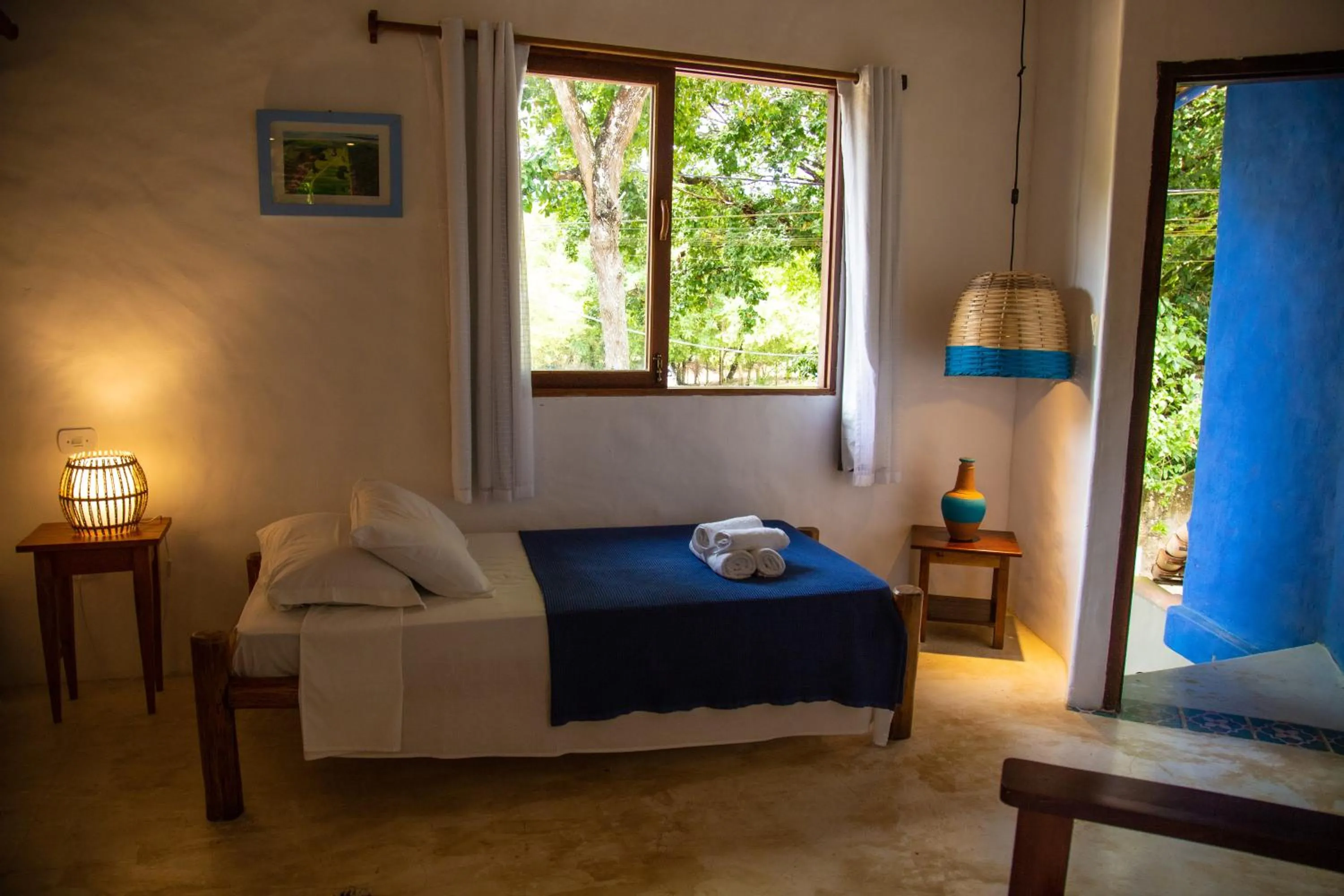 Bed in Pousada Le Refuge