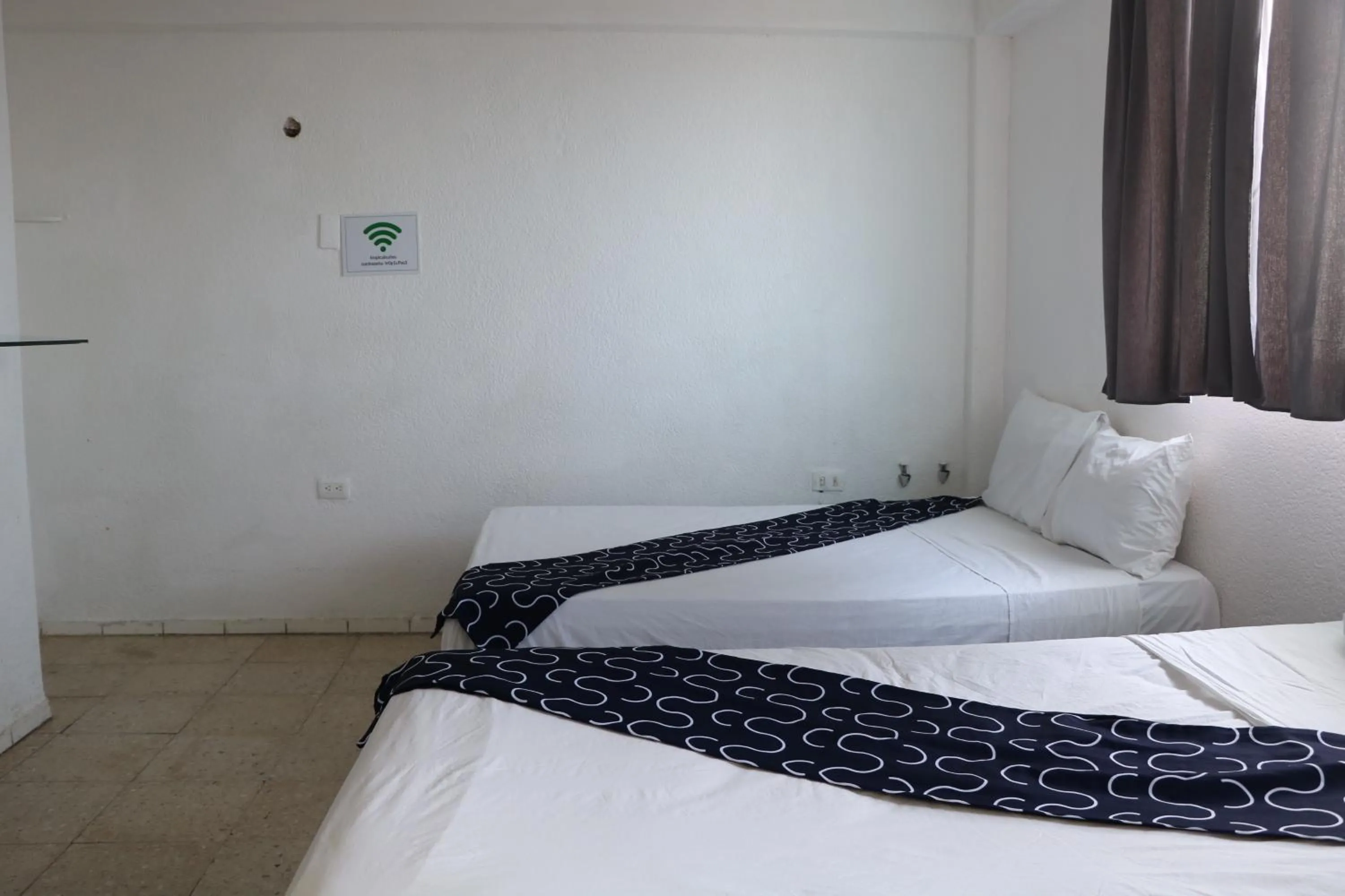 Bed in Hotel Tropical