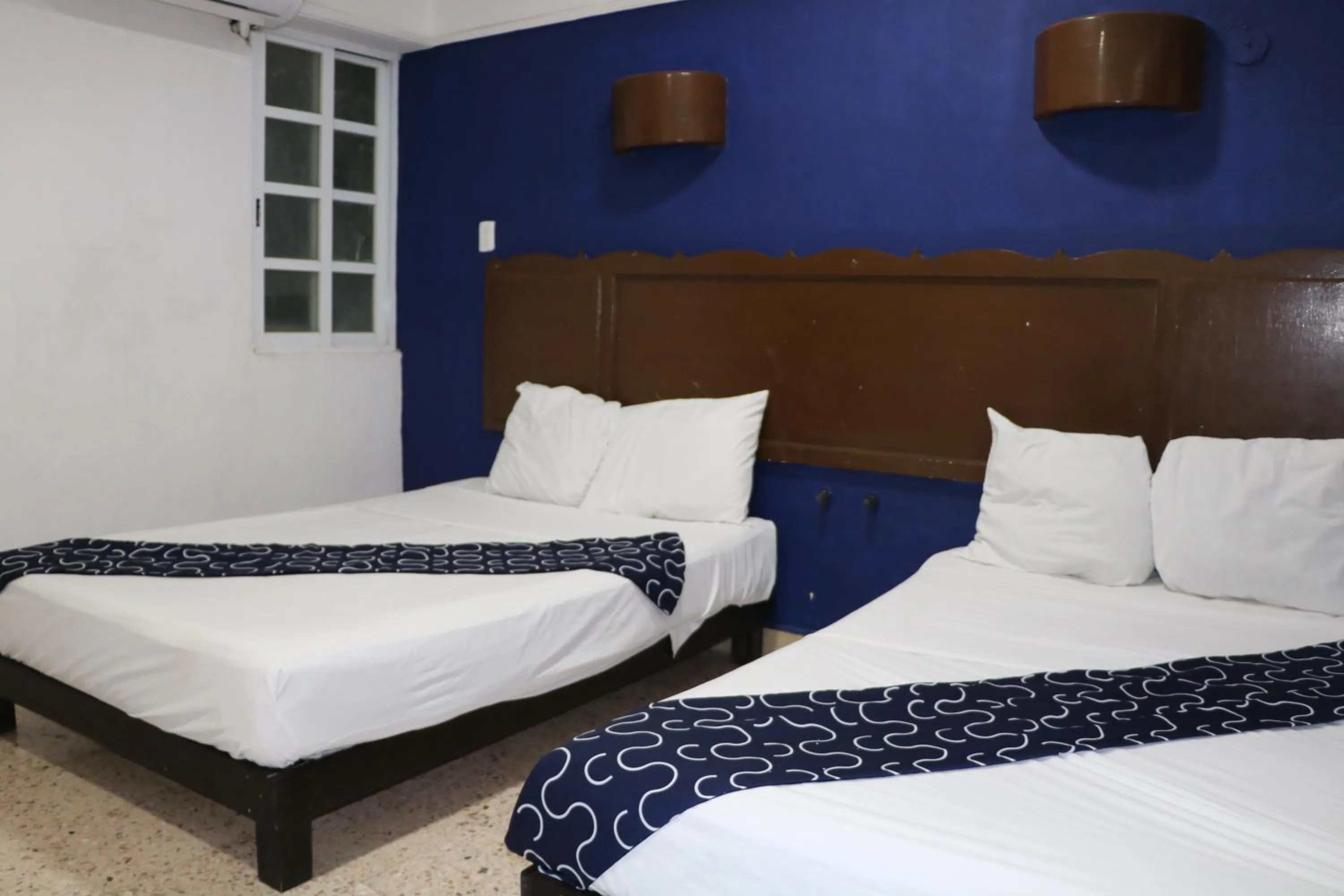 Bed in Hotel Tropical