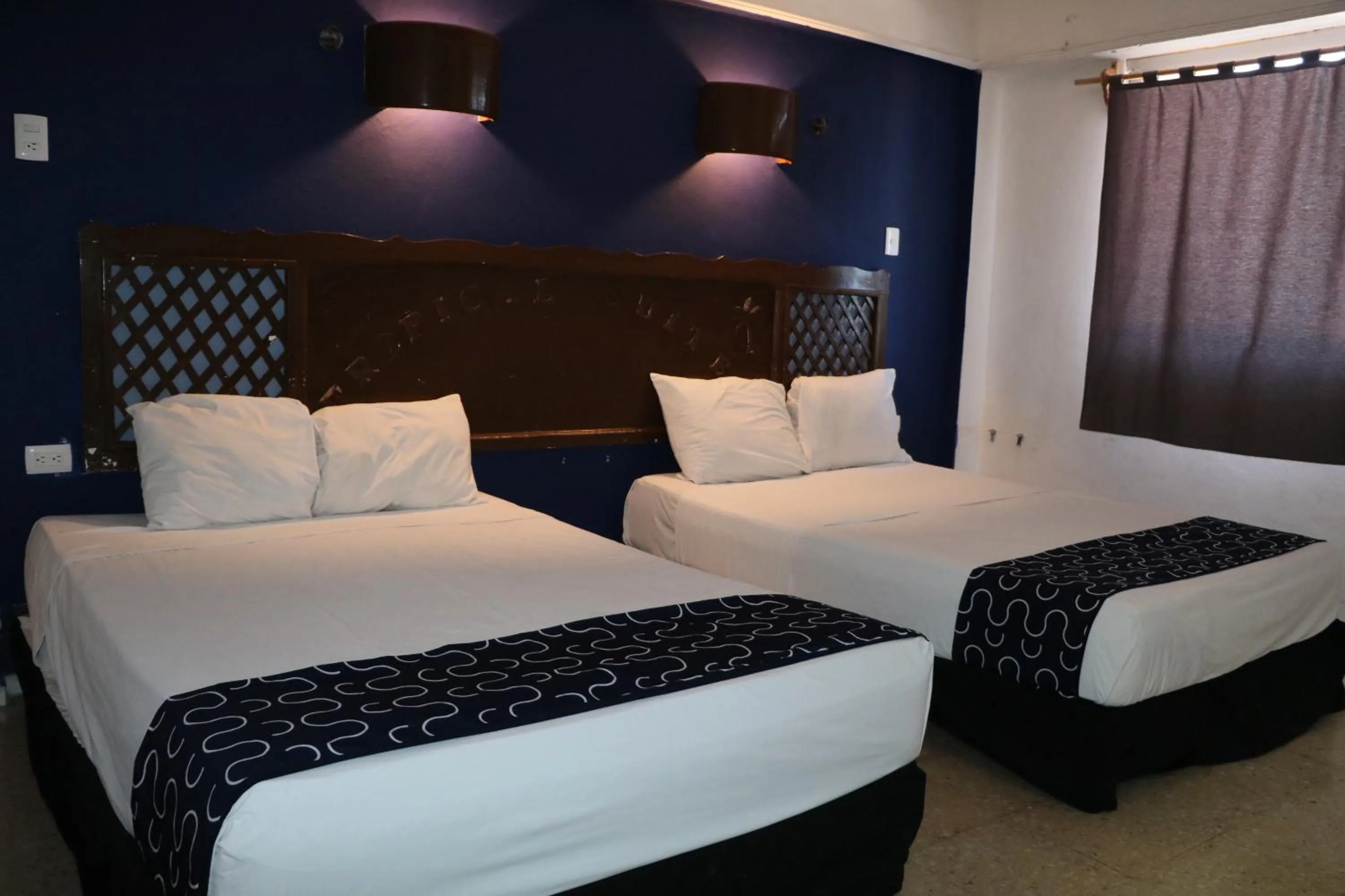 Bed in Hotel Tropical