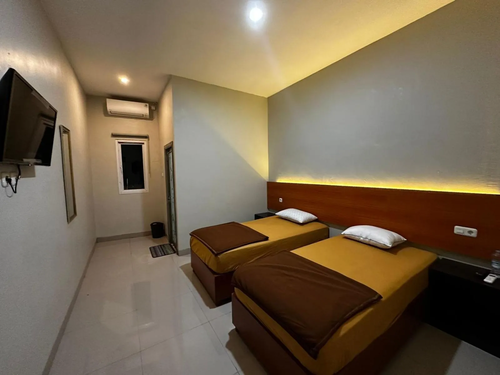 Bed in Grands Orchid Hotel